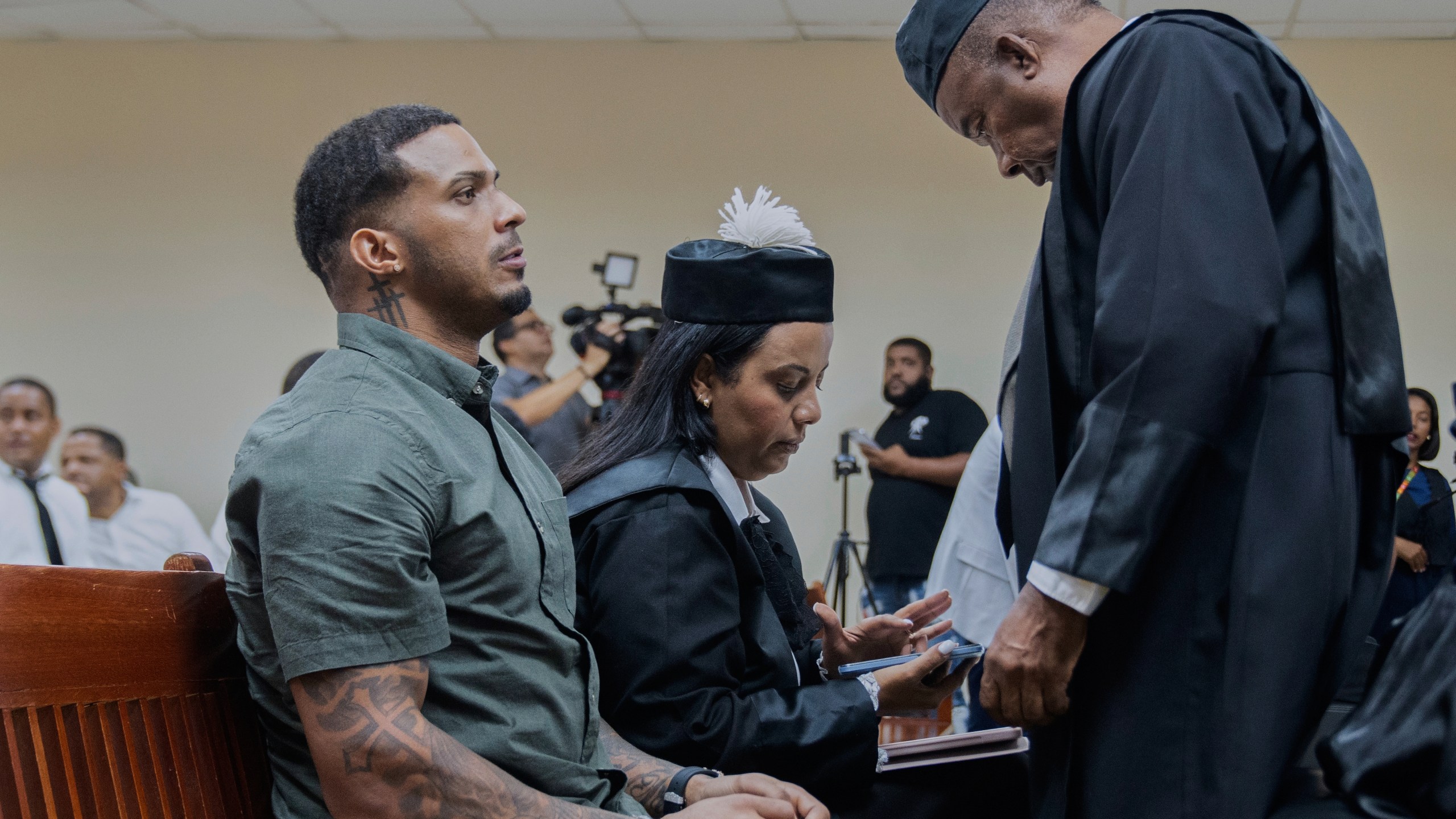 Tampa Bay Rays shortstop Wander Franco, left, reacts during his trial on charges of sexual abuse of a minor, in Puerto Plata, Dominican Republic, Thursday, June 26, 2025. (AP Photo/Fran Afonso)