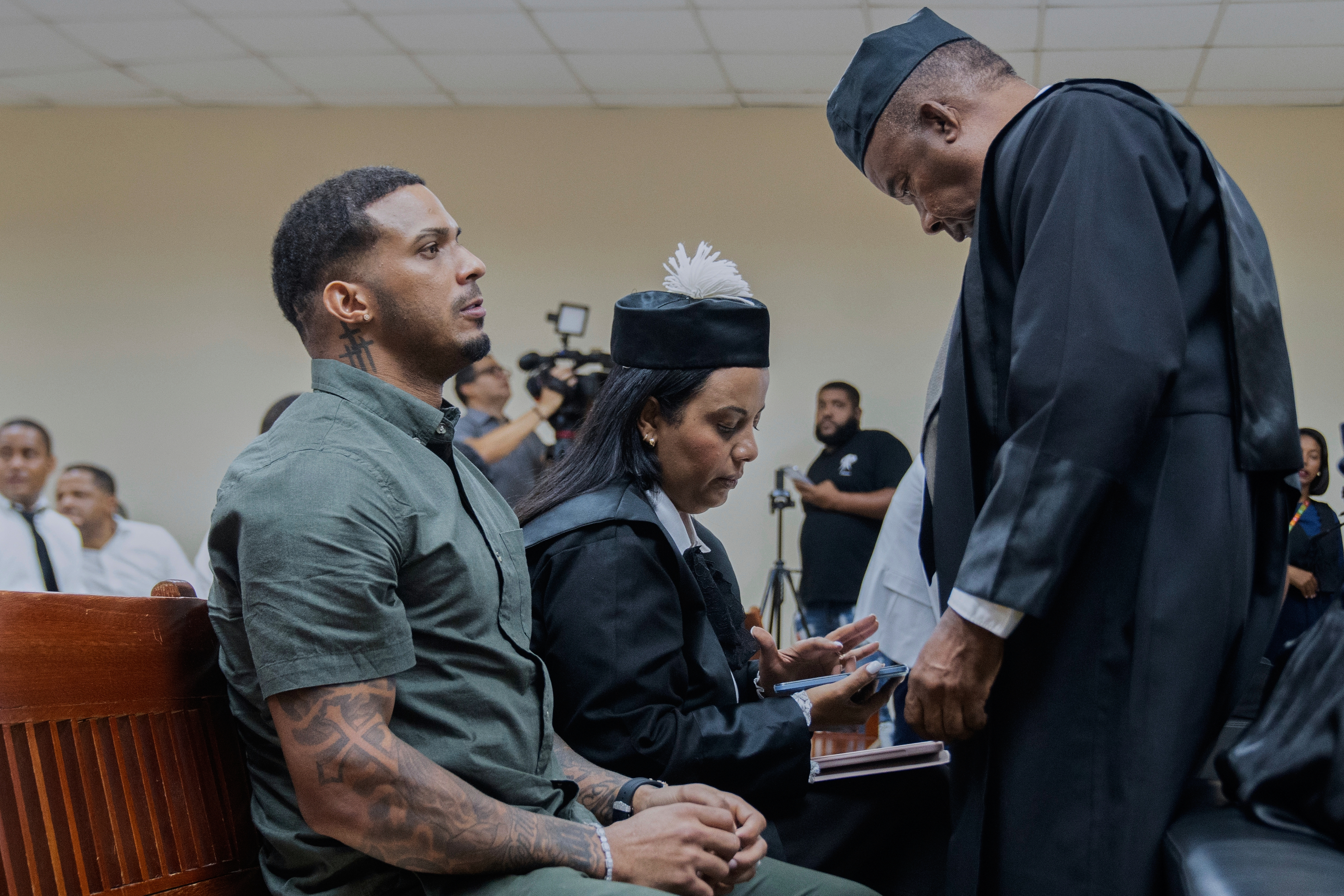 Tampa Bay Rays shortstop Wander Franco, left, reacts during his trial on charges of sexual abuse of a minor, in Puerto Plata, Dominican Republic, Thursday, June 26, 2025. (AP Photo/Fran Afonso)