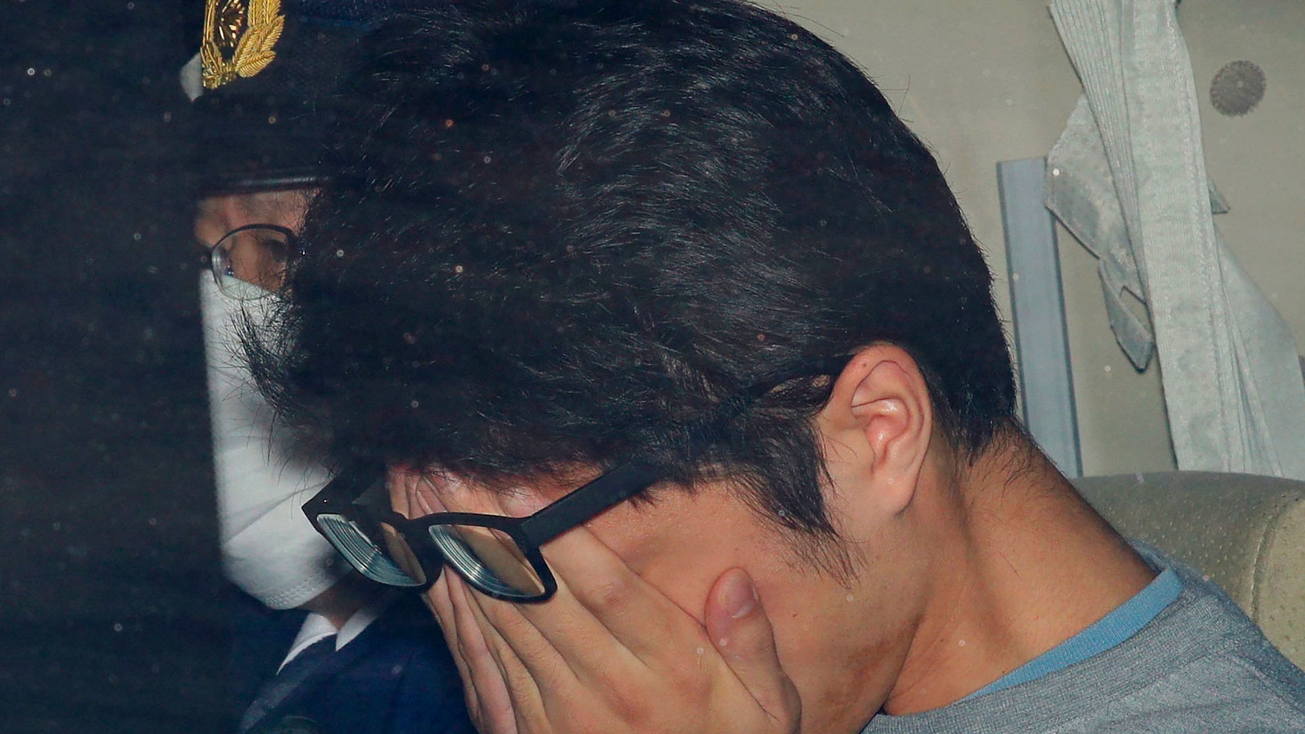 FILE - Takahiro Shiraishi leaves a police station in Hachioji, suburbs of Tokyo, in November 2017. (Takuya Inaba/Kyodo News via AP, File)