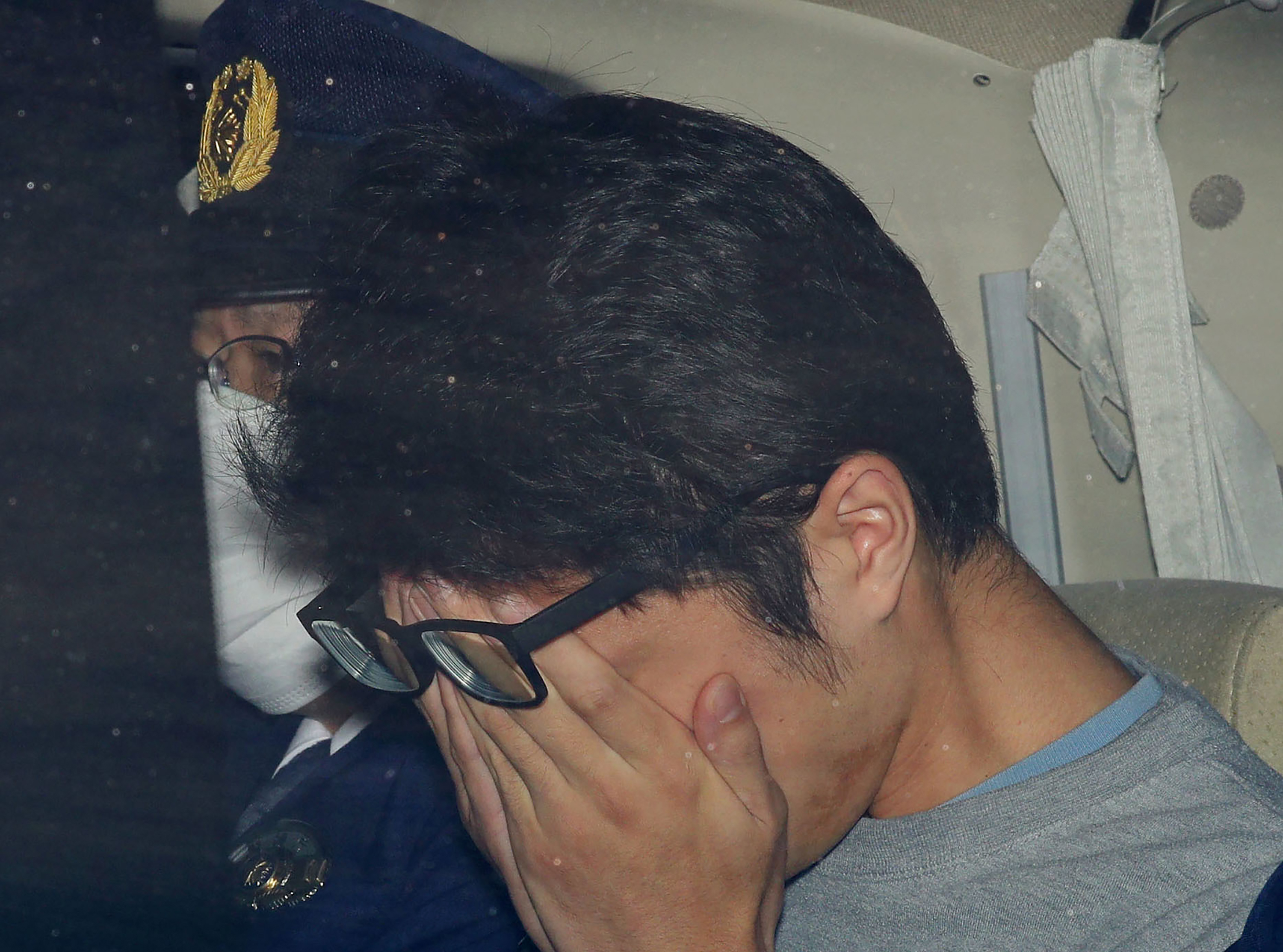 FILE - Takahiro Shiraishi leaves a police station in Hachioji, suburbs of Tokyo, in November 2017. (Takuya Inaba/Kyodo News via AP, File)