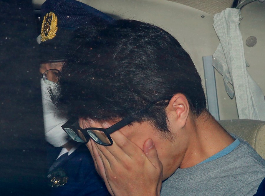 FILE - Takahiro Shiraishi leaves a police station in Hachioji, suburbs of Tokyo, in November 2017. (Takuya Inaba/Kyodo News via AP, File)