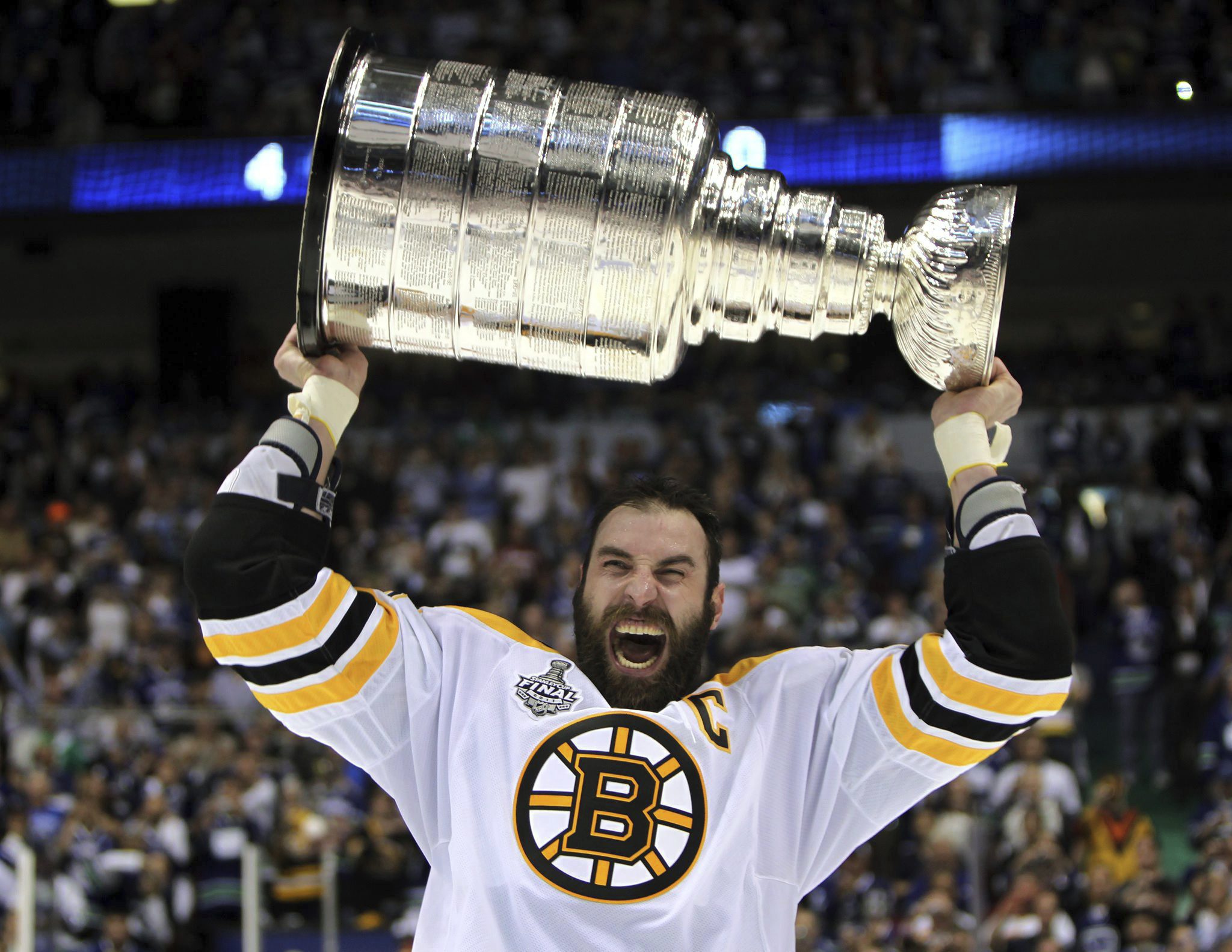 FILE - Boston Bruins' Zdeno Chara, of Slovakia, hoists the cup following the Bruins' 4-0 win over the Vancouver Canucks in Game 7 of the NHL hockey Stanley Cup Finals on June 15, 2011, in Vancouver, British Columbia, Canada. (Jonathan Hayward/The Canadian Press via AP)