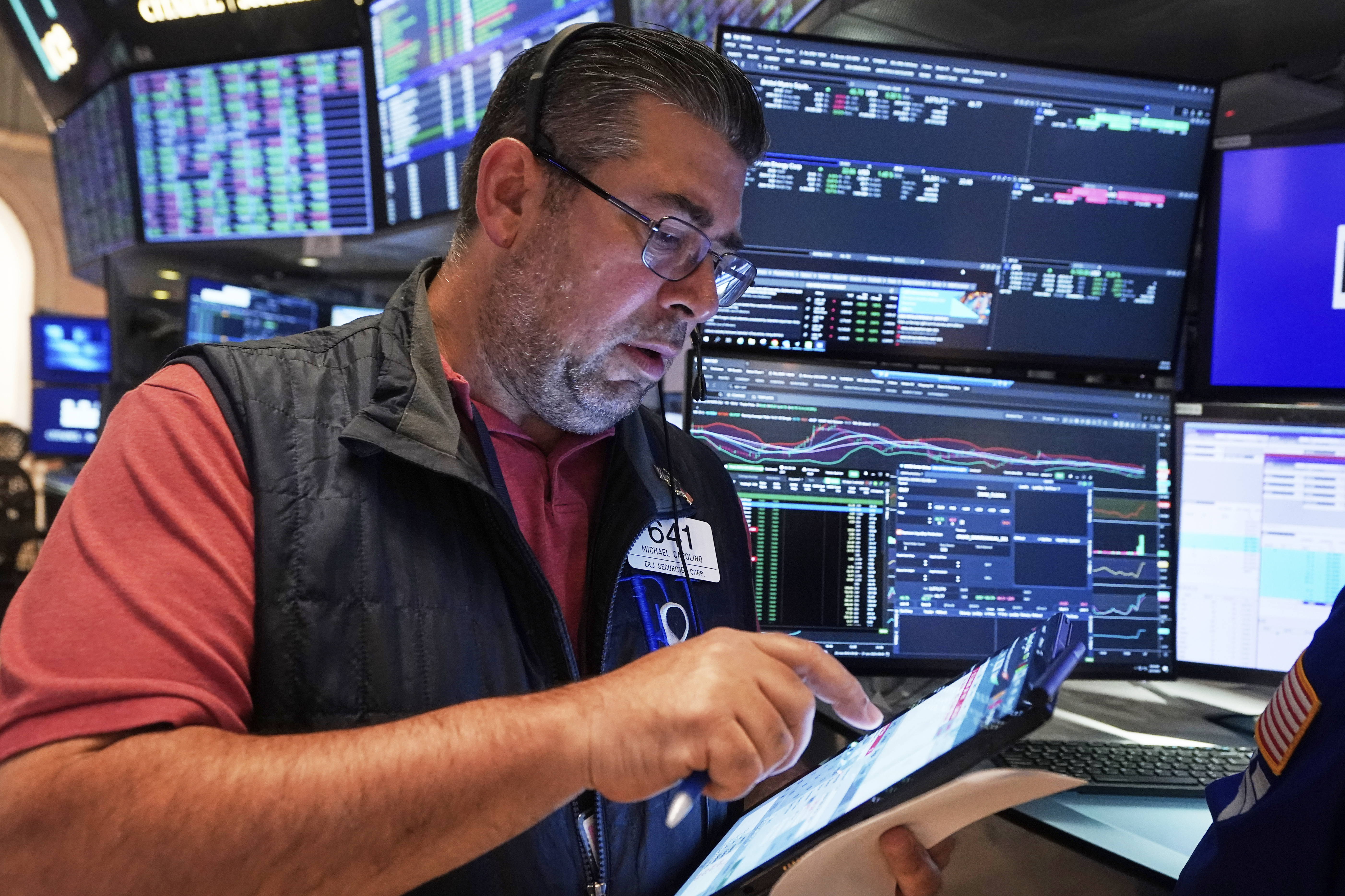 Trader Michael Capolino works on the floor of the New York Stock Exchange, Friday, June 27, 2025. (AP Photo/Richard Drew)