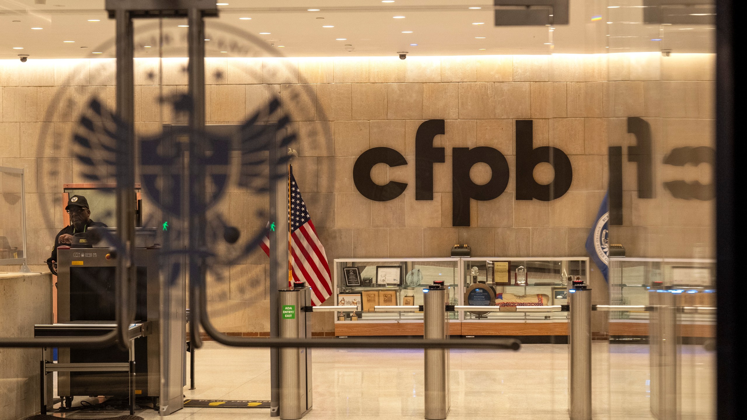 FILE - A security officer works inside of the Consumer Financial Protection Bureau (CFPB) building headquarters, Feb. 10, 2025, in Washington. (AP Photo/Jacquelyn Martin, File)