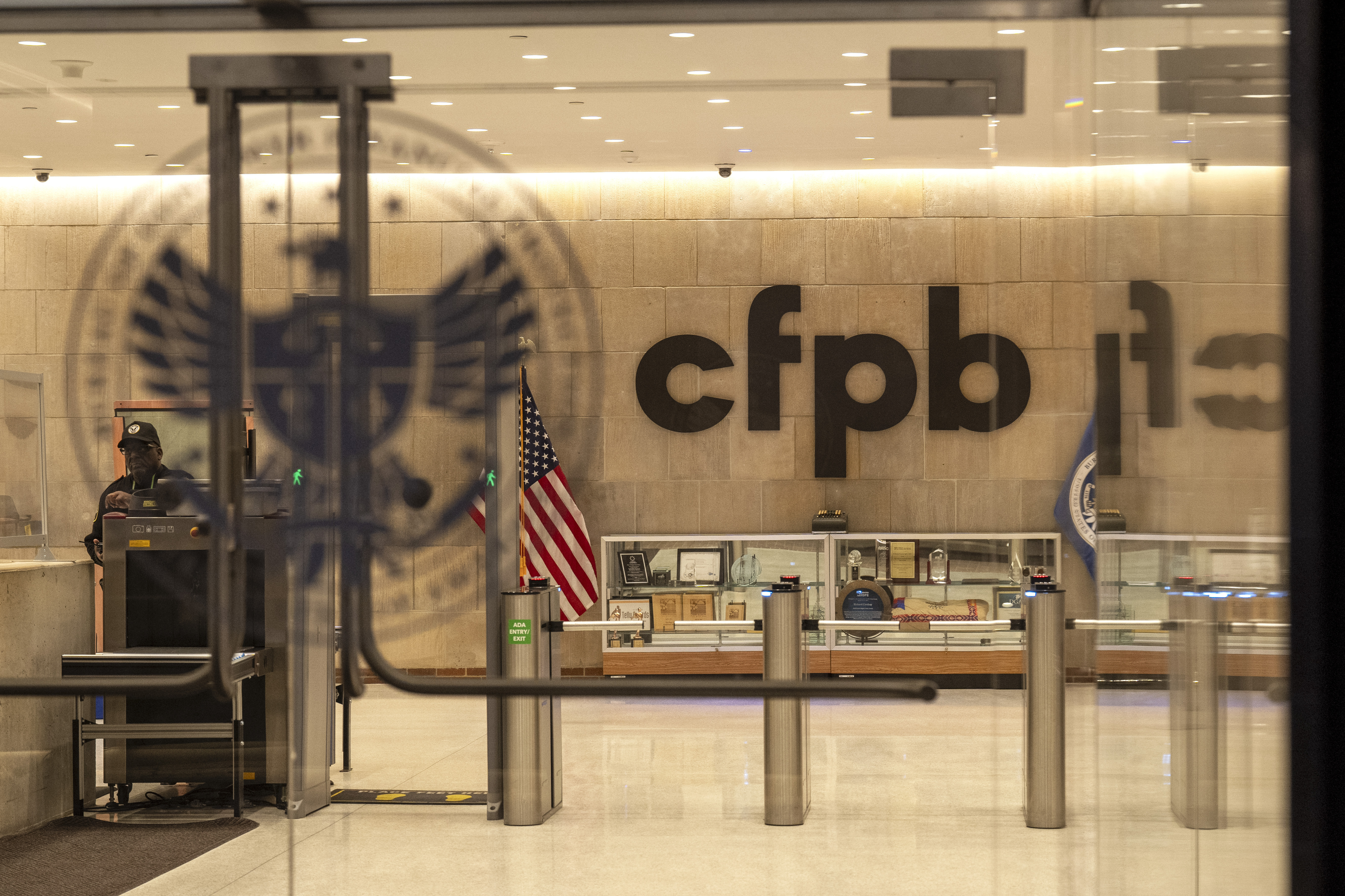FILE - A security officer works inside of the Consumer Financial Protection Bureau (CFPB) building headquarters, Feb. 10, 2025, in Washington. (AP Photo/Jacquelyn Martin, File)