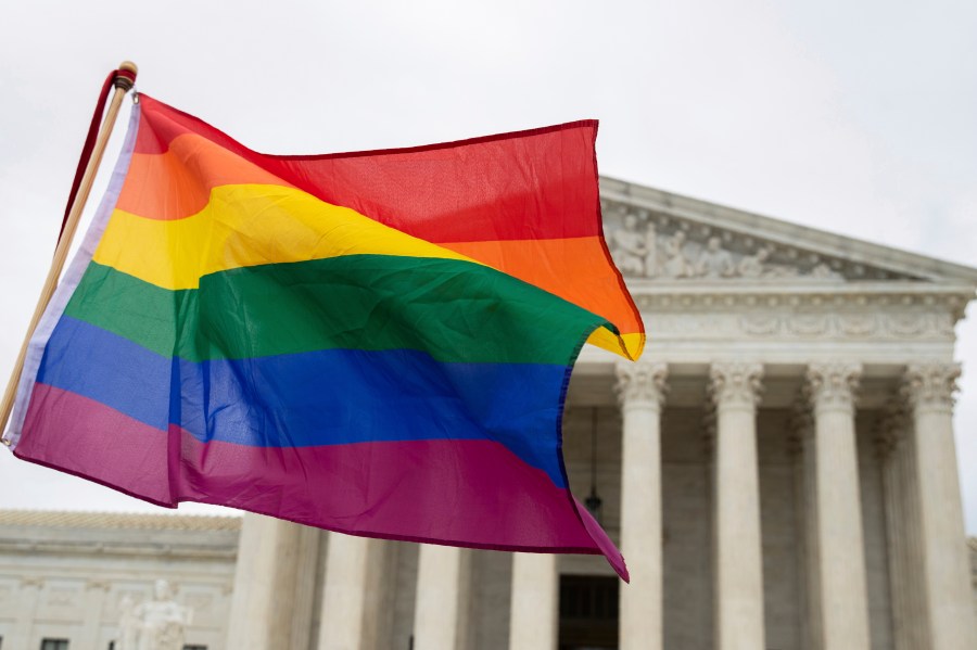 FILE - A pride flag is seen in front of the U.S. Supreme Court, Oct. 8, 2019, in Washington. (AP Photo/Manuel Balce Ceneta, File)