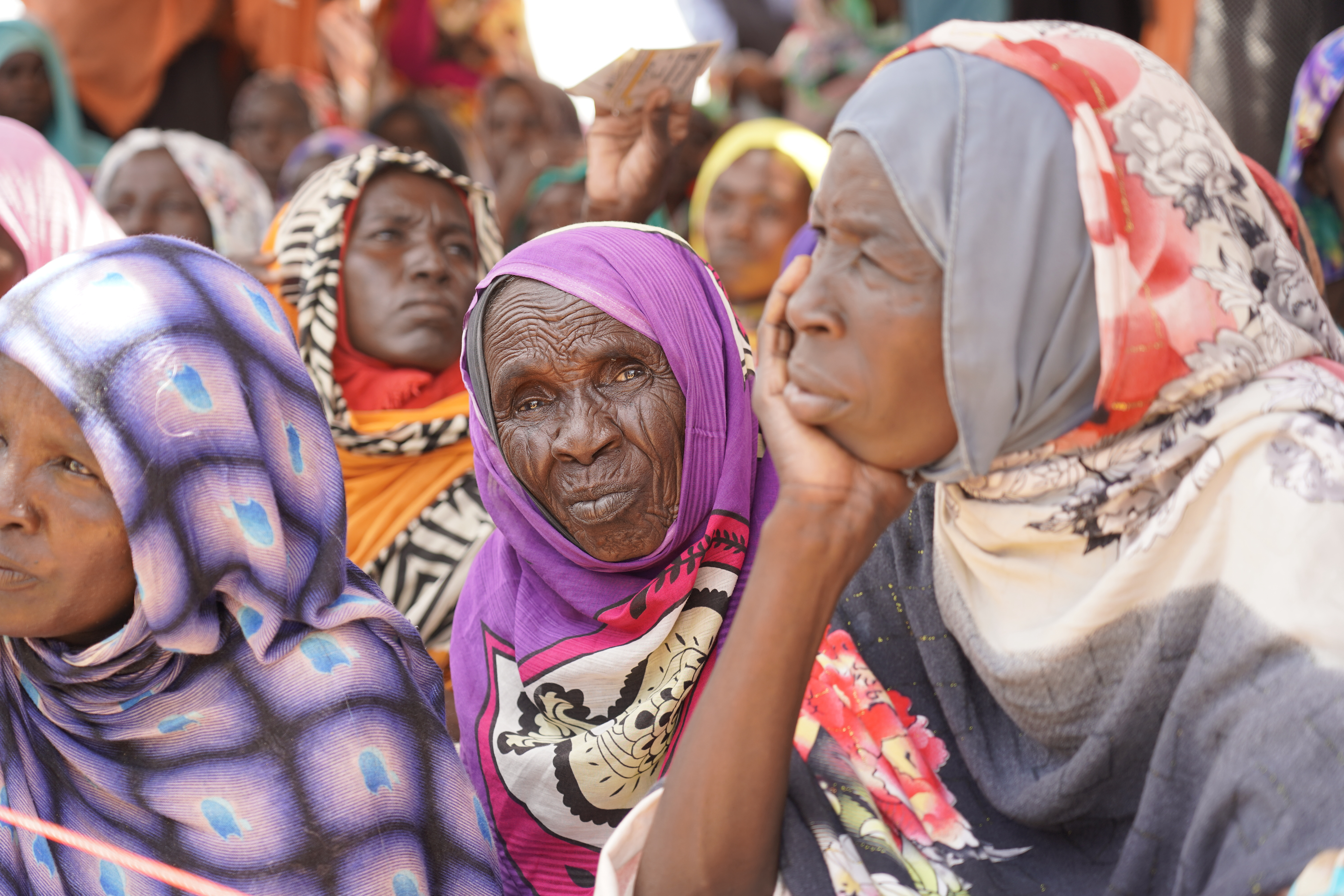 This September 2022 photo provided by the World Food Program shows internally displaced people at the ZamZam camp in El Fasher, North Darfur state, Sudan. (Leni Kinzli/WFP via AP)
