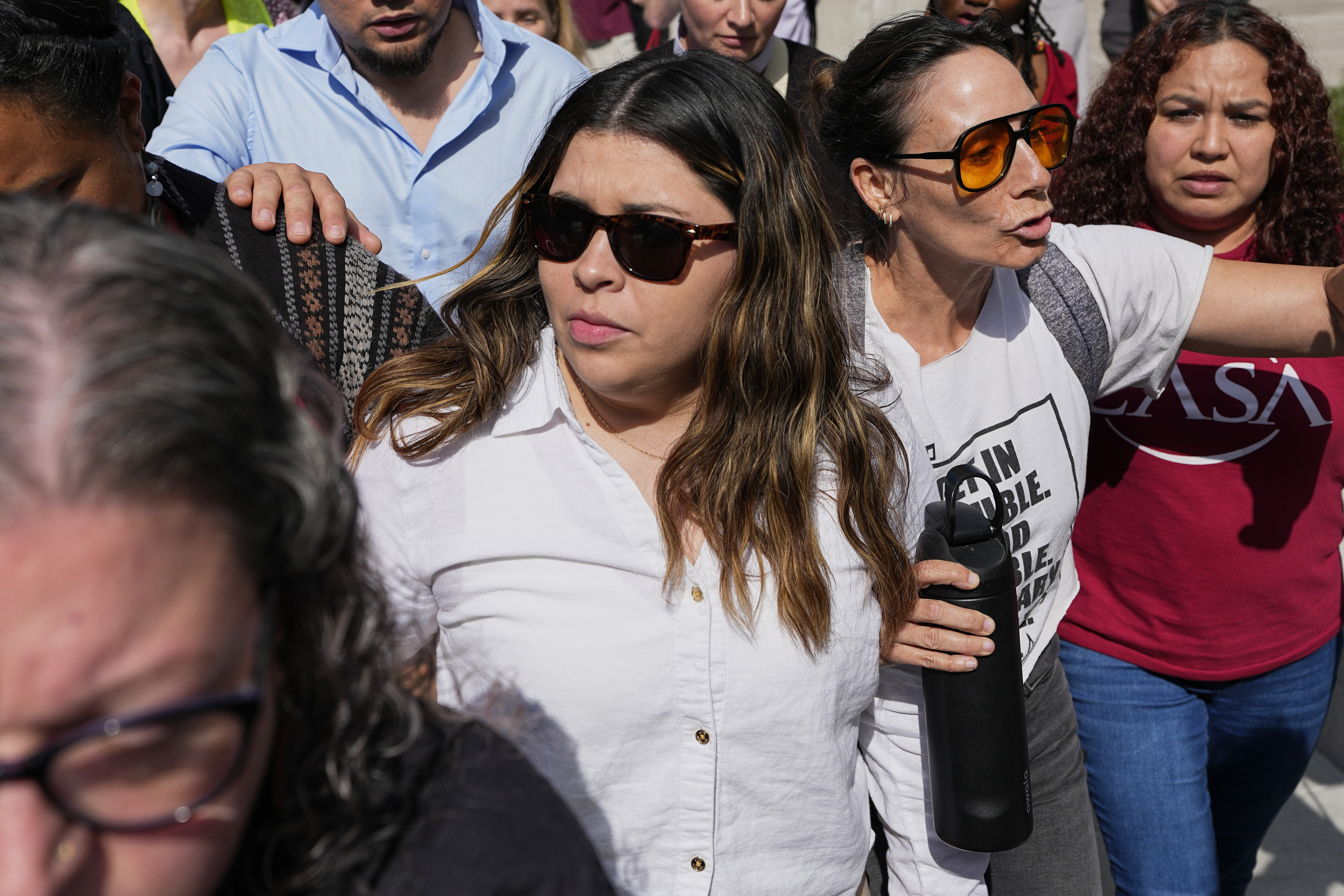 Jennifer Vasquez Sura, center left, wife of Kilmar Abrego Garcia leaves the federal courthouse Wednesday, June 25, 2025, in Nashville, Tenn. (AP Photo/George Walker IV)