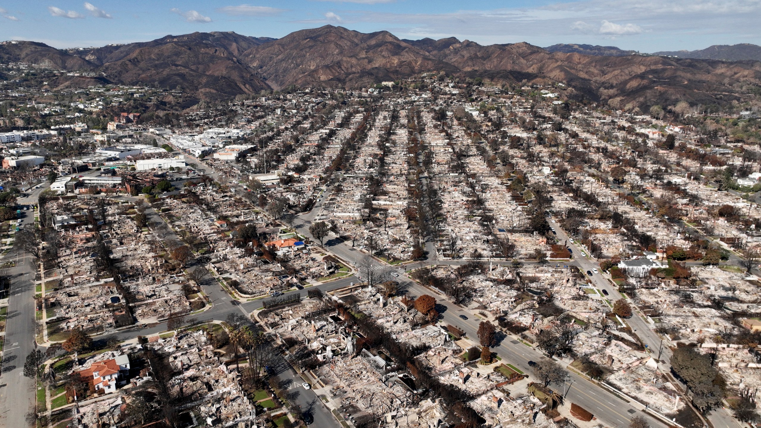 FILE - The devastation from the Palisades Fire is seen in an aerial view in the Pacific Palisades neighborhood of Los Angeles, Monday, Jan. 27, 2025. (AP Photo/Jae C. Hong, File)
