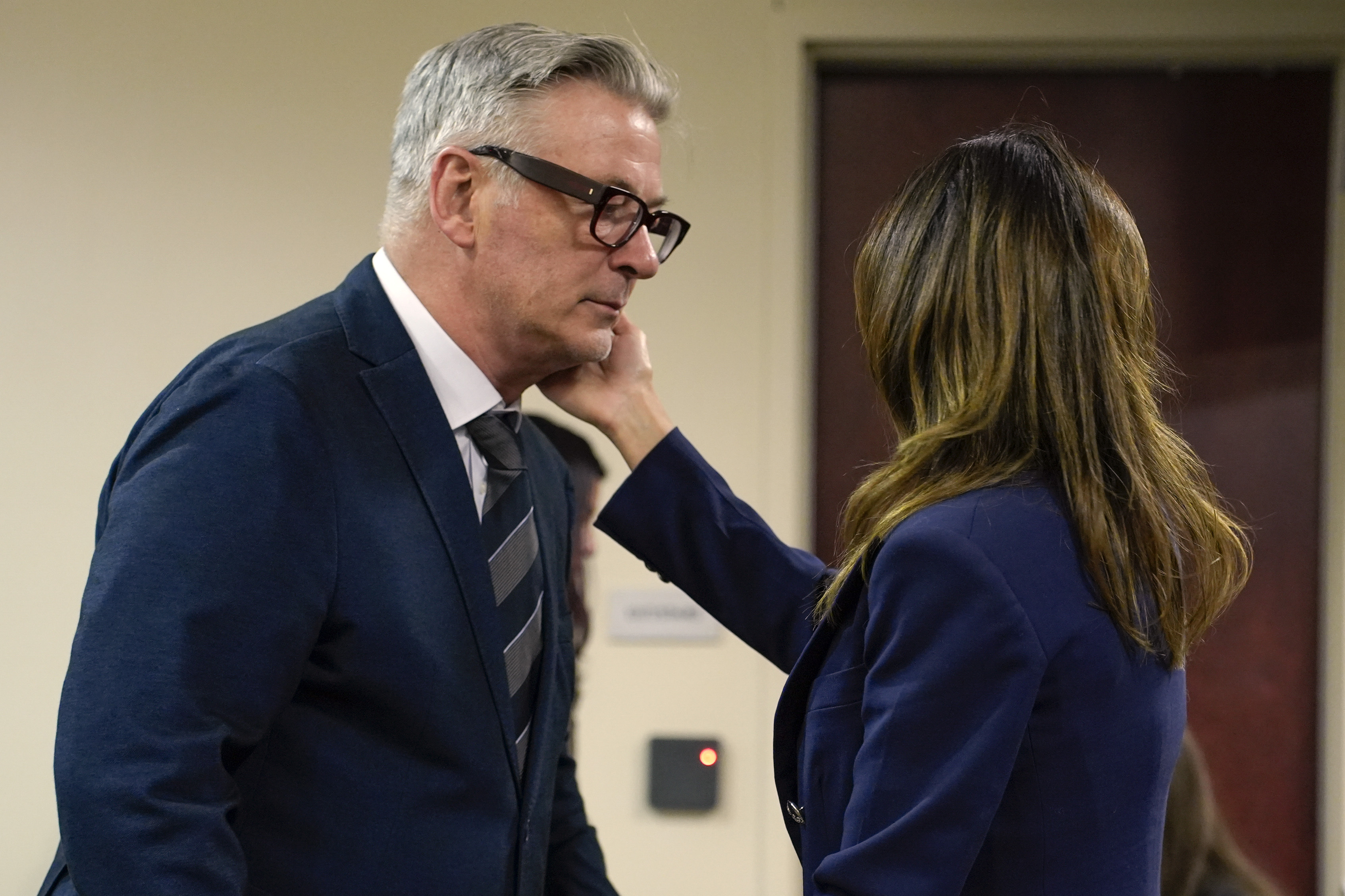 FILE - Actor Alec Baldwin approaches his wife Hilaria during his trial, July 11, 2024, in Santa Fe, N.M. (Ramsay de Give/Pool Photo via AP, File)