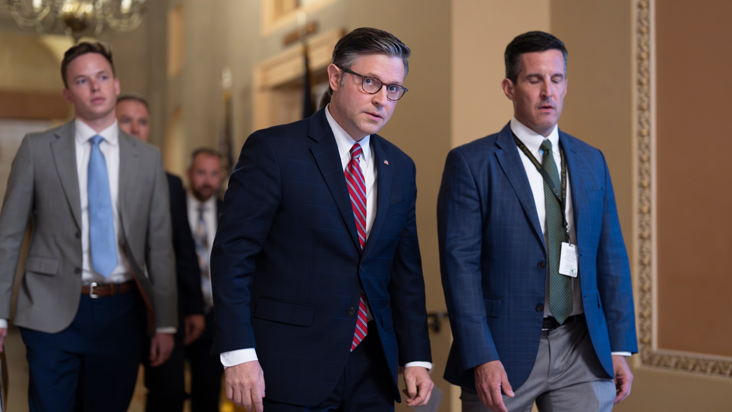 Speaker of the House Mike Johnson, R-La., center, arrives for a closed-door Republican meeting to advance President Donald Trump's sweeping domestic policy bill, at the Capitol in Washington, Friday, June 27, 2025. (AP Photo/J. Scott Applewhite)