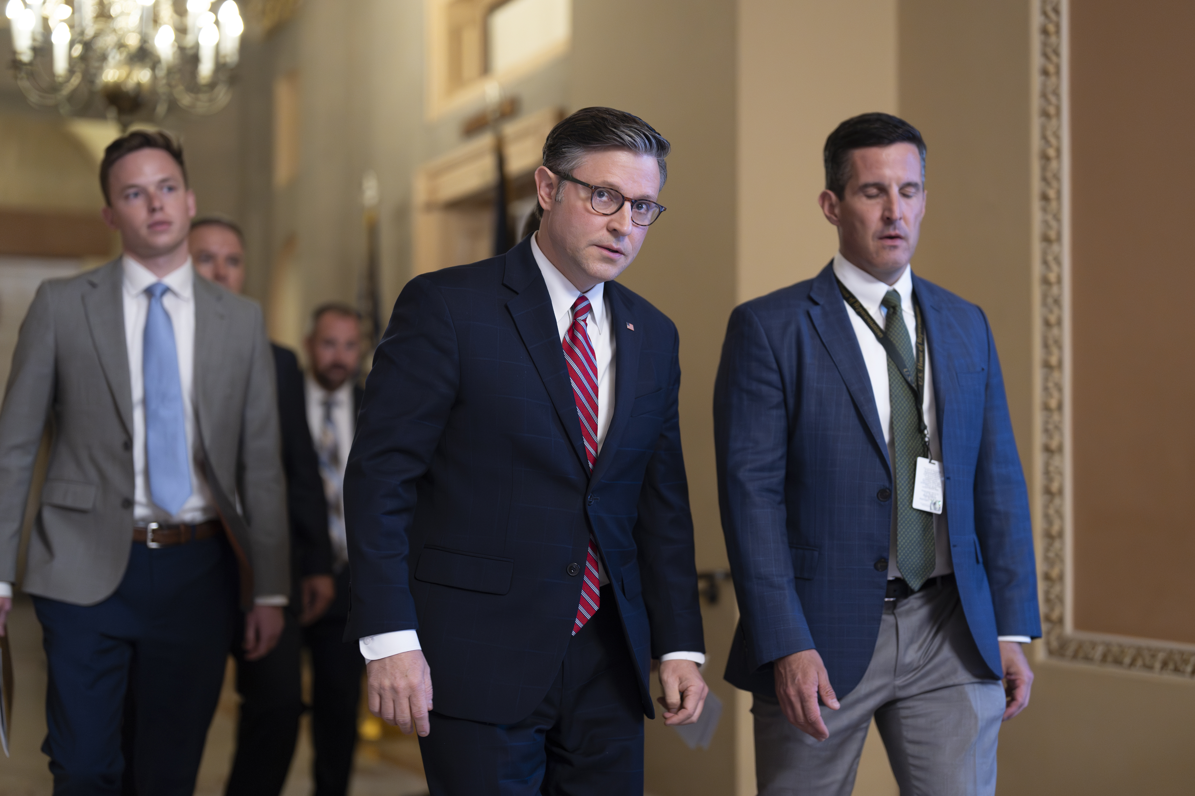 Speaker of the House Mike Johnson, R-La., center, arrives for a closed-door Republican meeting to advance President Donald Trump's sweeping domestic policy bill, at the Capitol in Washington, Friday, June 27, 2025. (AP Photo/J. Scott Applewhite)