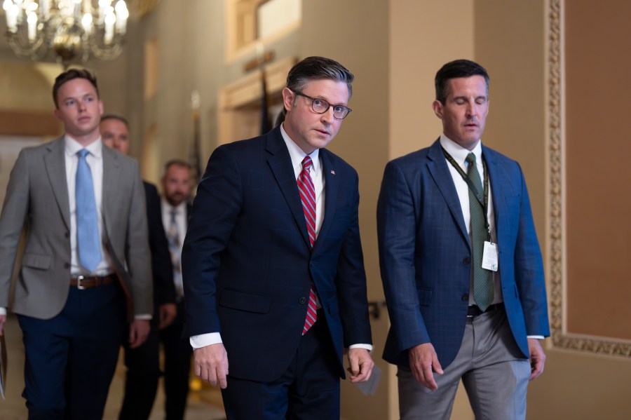 Speaker of the House Mike Johnson, R-La., center, arrives for a closed-door Republican meeting to advance President Donald Trump's sweeping domestic policy bill, at the Capitol in Washington, Friday, June 27, 2025. (AP Photo/J. Scott Applewhite)