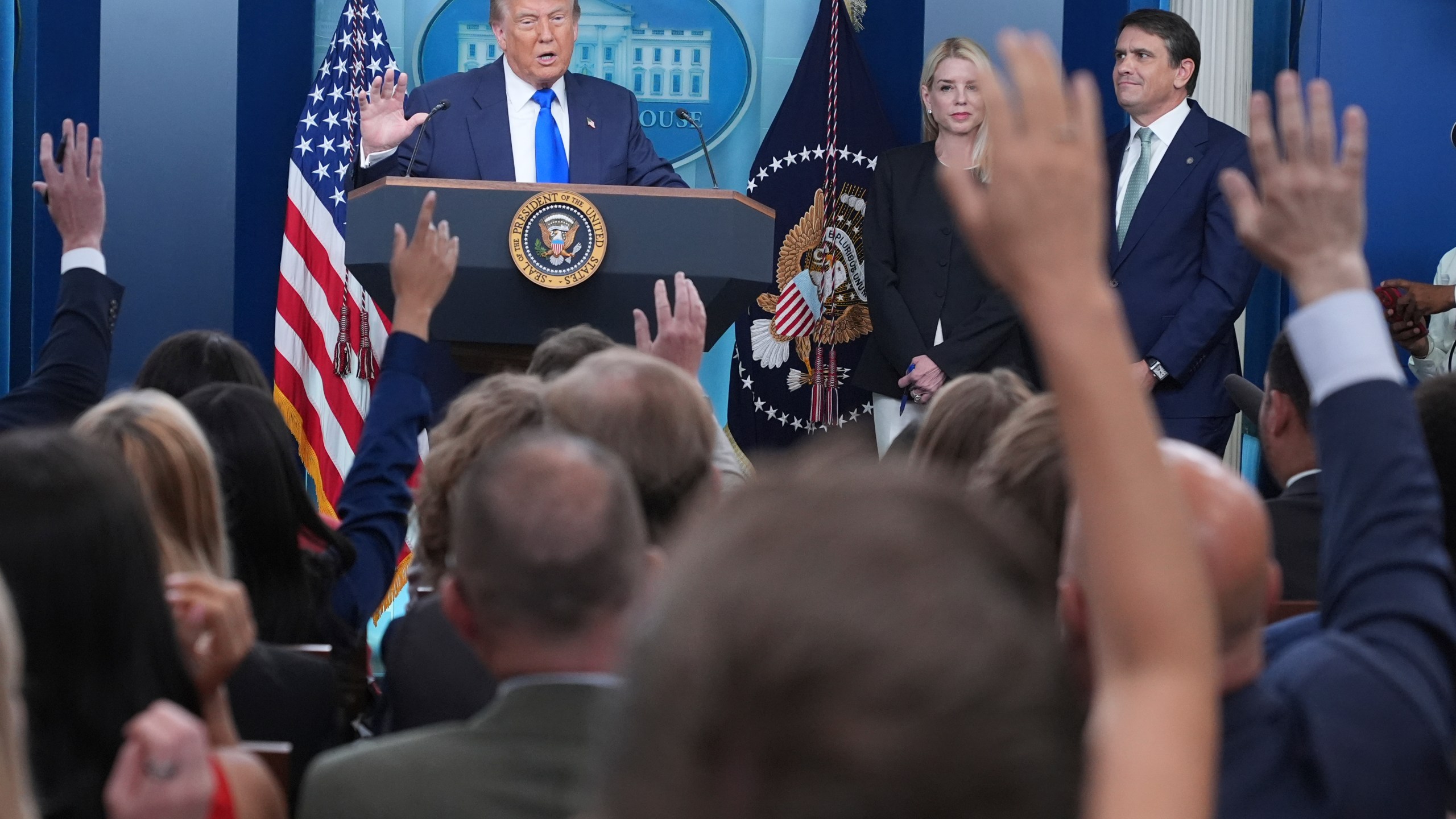 President Donald Trump, from left, speaks to the media as Attorney General Pam Bondi and Deputy Attorney General Todd Blance listen, Friday, June 27, 2025, in the briefing room of the White House in Washington. (AP Photo/Jacquelyn Martin)