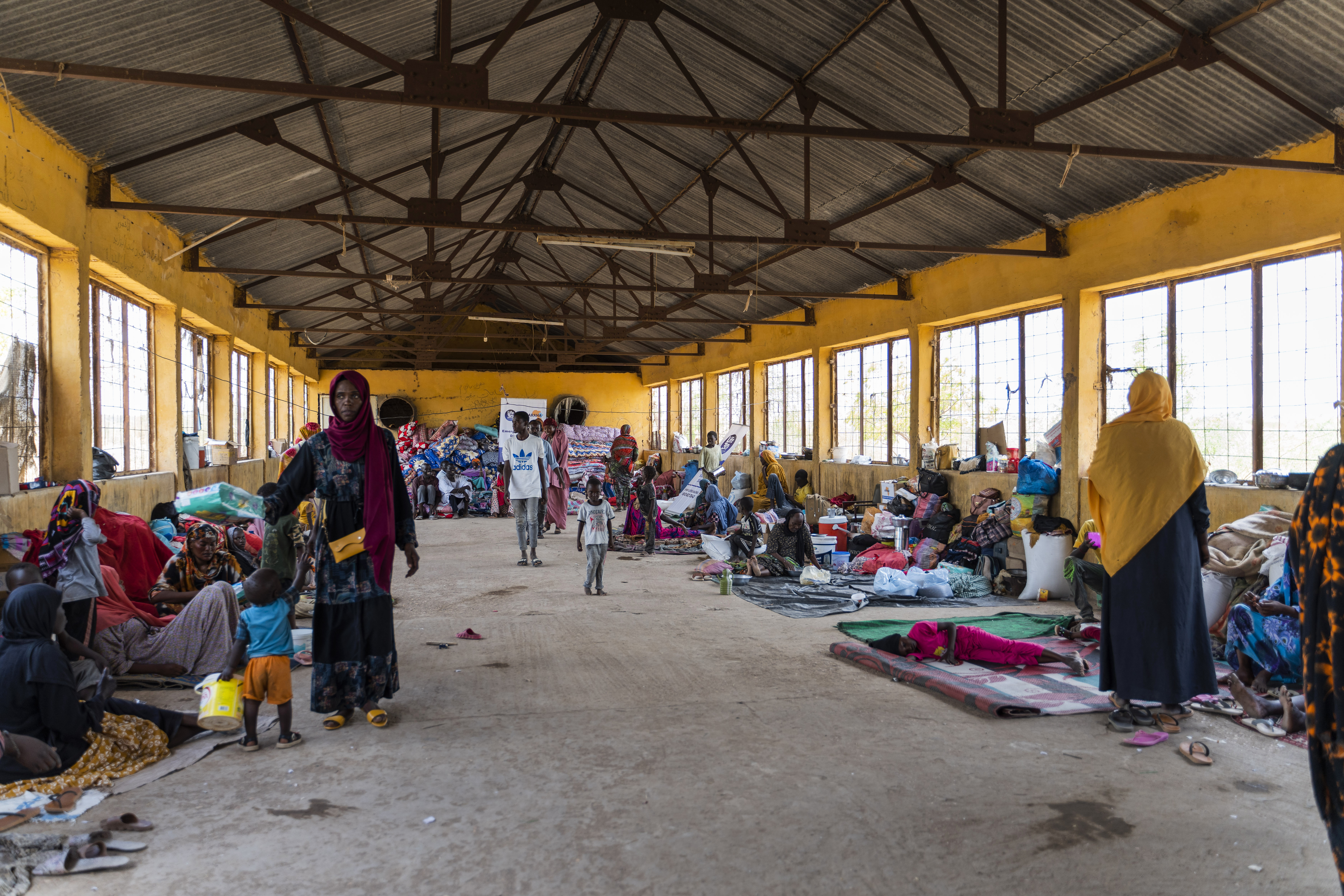 This June 2023 photo provided by the World Food Program shows internally displaced persons at the Wad Almajzoub farm camp in Wad Medani, Gezira state, Sudan. (Ala Kheir/U.N. Office for the Coordination of Humanitarian Affairs via AP)
