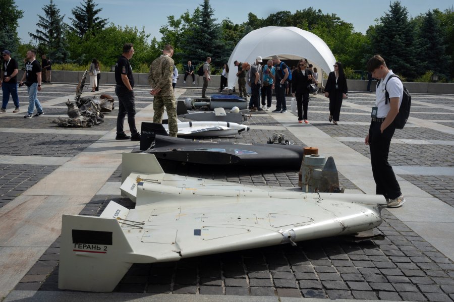 Visitors check damaged Russian drones during the International Conference on Expanding Sanctions Against Russia in Kyiv, Ukraine, Friday, June 27, 2025. (AP Photo/Efrem Lukatsky)