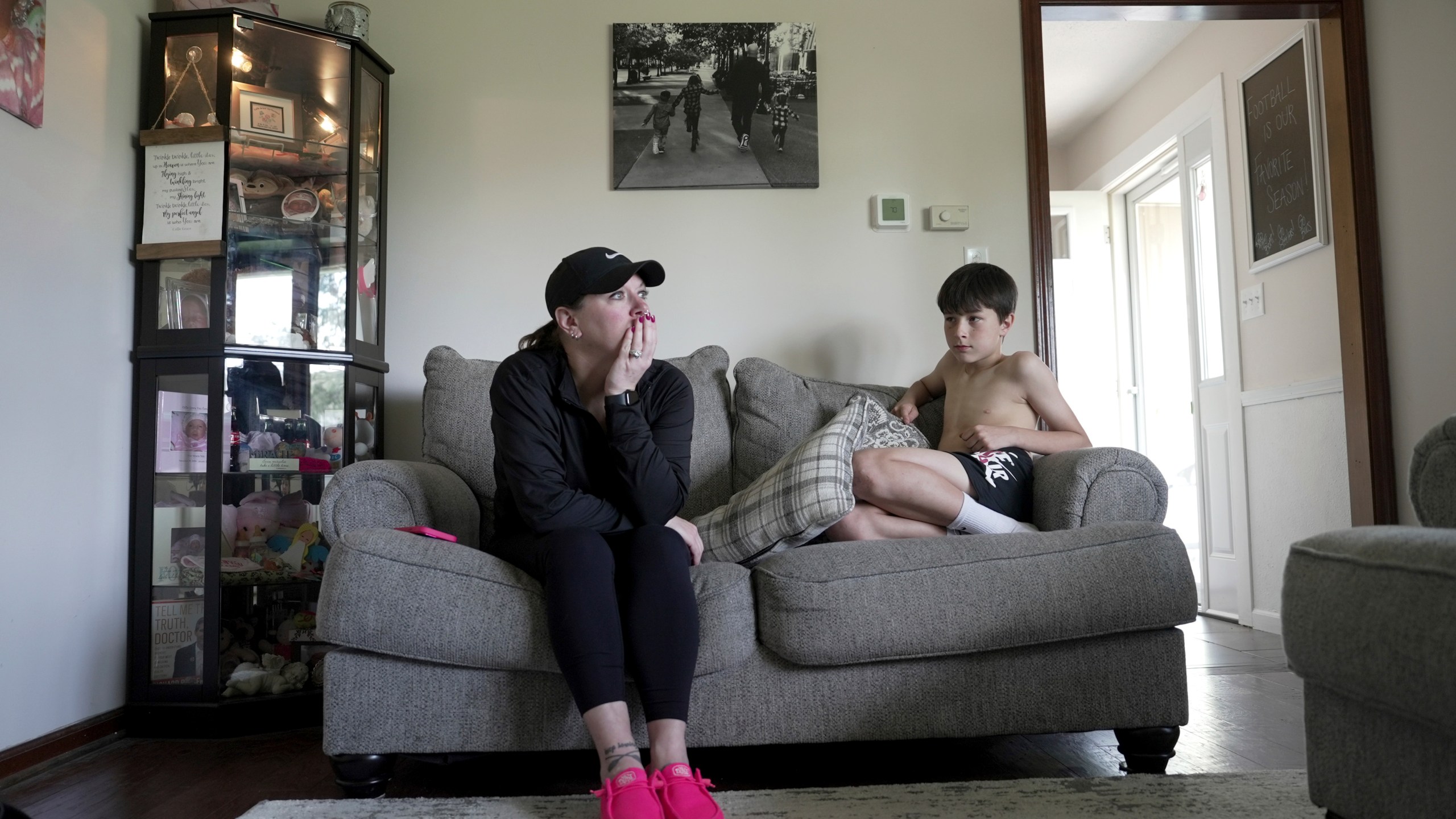 Katie Van Tornhout sits with her son, Cain, at home in Lakeville, Ind., on May 7, 2025. (AP Photo/Shelby Lum)