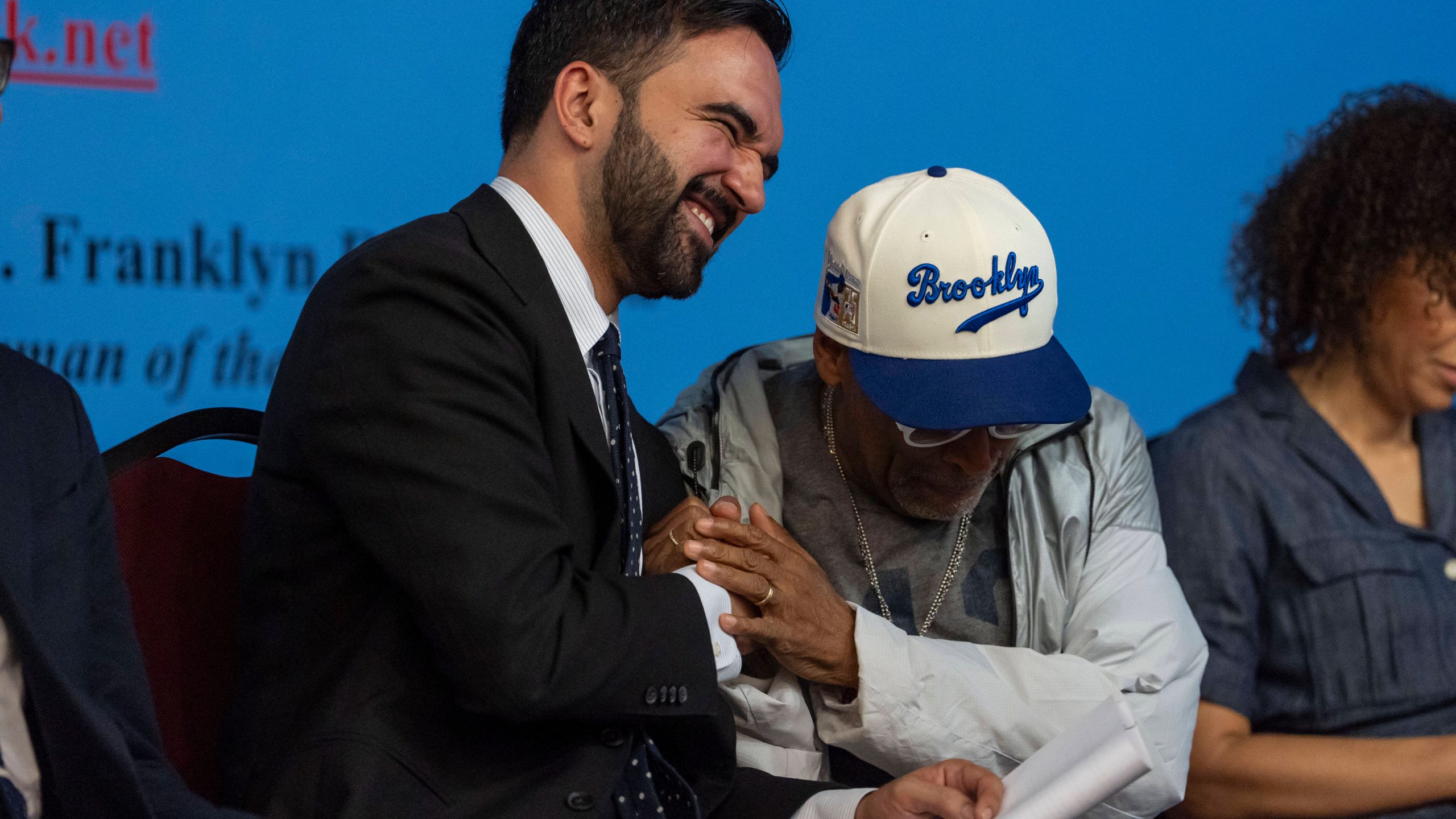 Spike Lee, right, and Democratic mayoral candidate Zohran Mamdani, left, react during the National Action Network's Saturday action rally at House of Justice in Harlem, Saturday, June 28, 2025, in New York. (AP Photo/Yuki Iwamura)