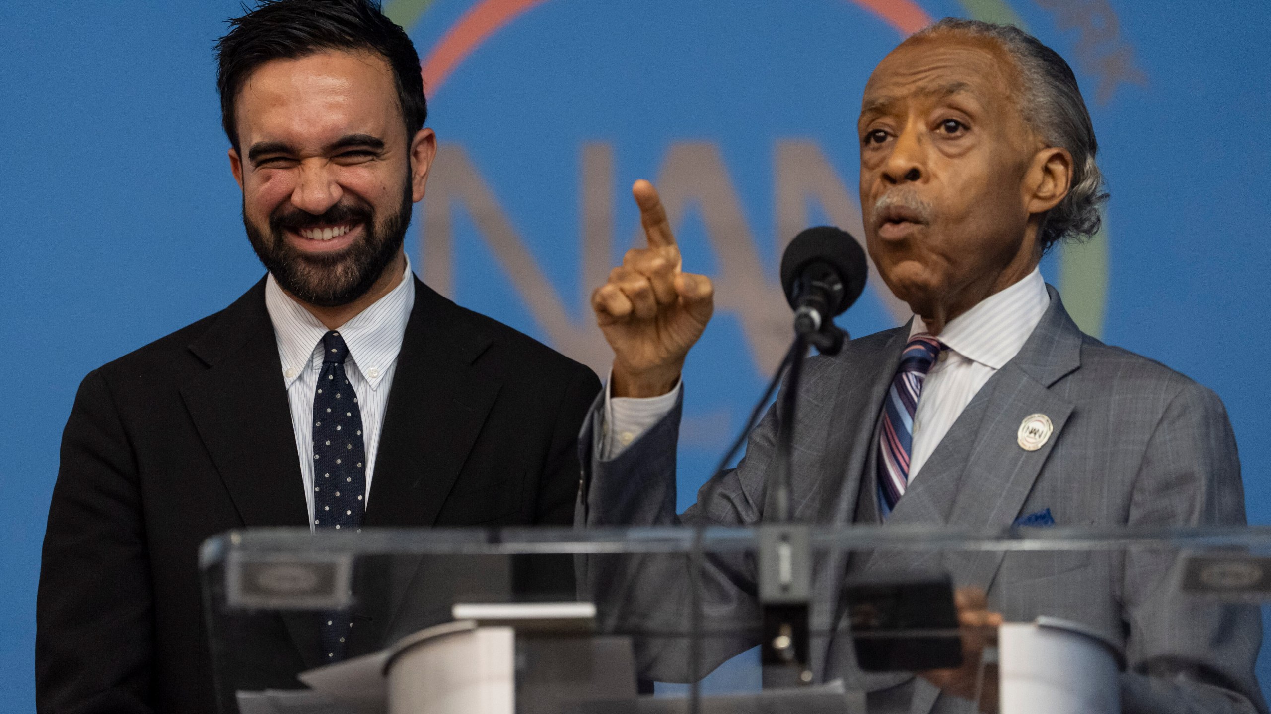Rev. Al Sharpton, right, and Democratic mayoral candidate Zohran Mamdani, left, speak during the National Action Network's Saturday action rally at House of Justice in Harlem, Saturday, June 28, 2025, in New York. (AP Photo/Yuki Iwamura)