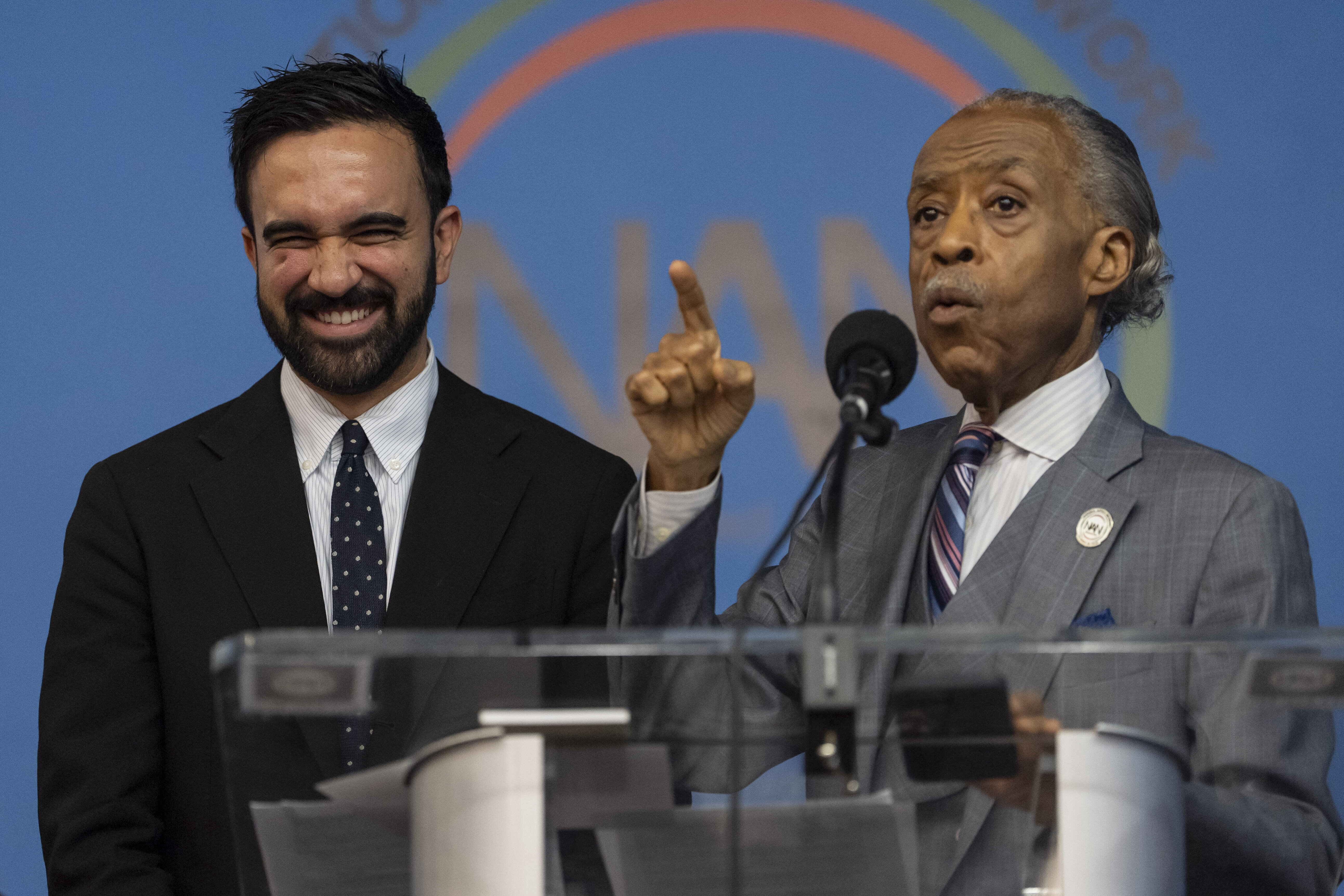 Rev. Al Sharpton, right, and Democratic mayoral candidate Zohran Mamdani, left, speak during the National Action Network's Saturday action rally at House of Justice in Harlem, Saturday, June 28, 2025, in New York. (AP Photo/Yuki Iwamura)