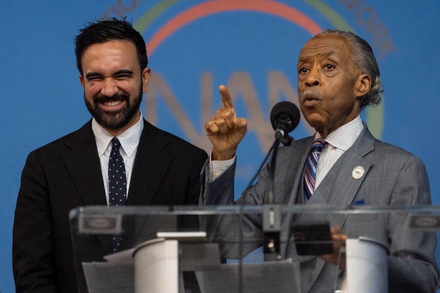 Rev. Al Sharpton, right, and Democratic mayoral candidate Zohran Mamdani, left, speak during the National Action Network's Saturday action rally at House of Justice in Harlem, Saturday, June 28, 2025, in New York. (AP Photo/Yuki Iwamura)