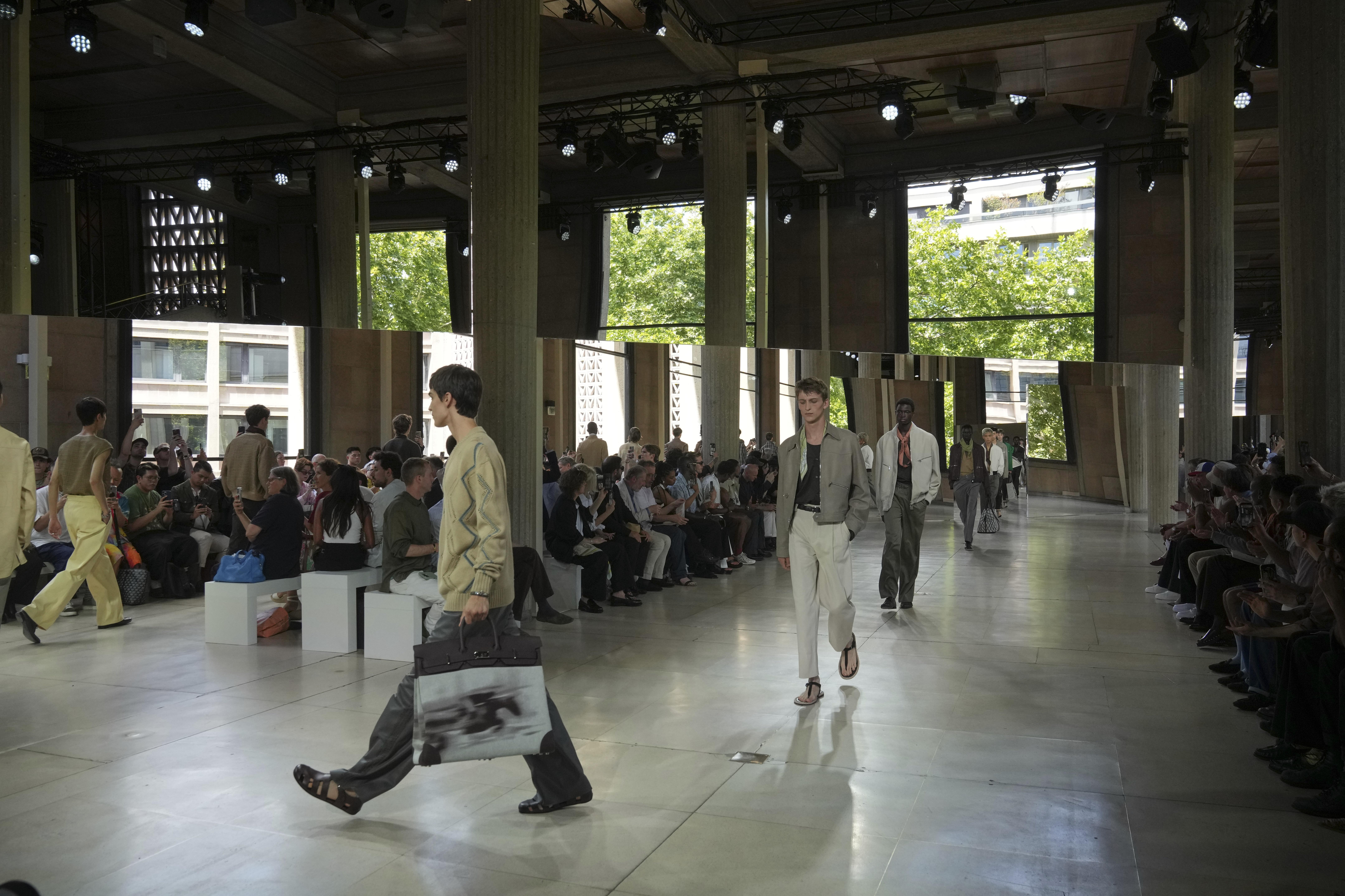 Models wear creations as part of the men's Hermes Spring-Summer 2026 collection, that was presented in Paris Saturday, June 28, 2025. (AP Photo/Michel Euler)