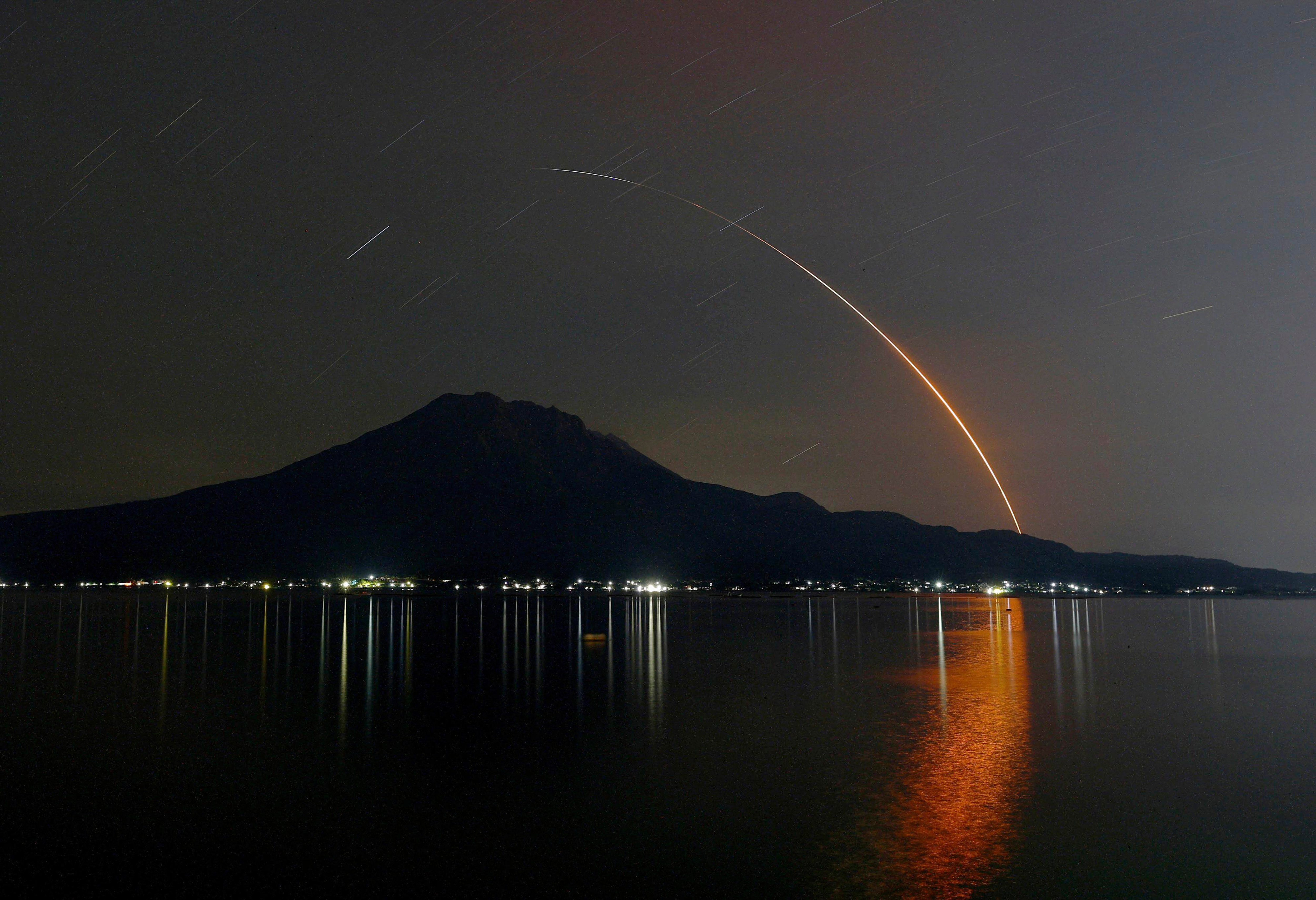 In this long exposure photo, an H-2A rocket carrying Global Observing SATellite for Greenhouse gases and Water cycle, or GOSAT-GW satellite, lifts off from Tanegashima Space Center, seen in Kagoshima, southern Japan, early Sunday, June 29, 2025. (Kotaro Ueda/Kyodo News via AP)