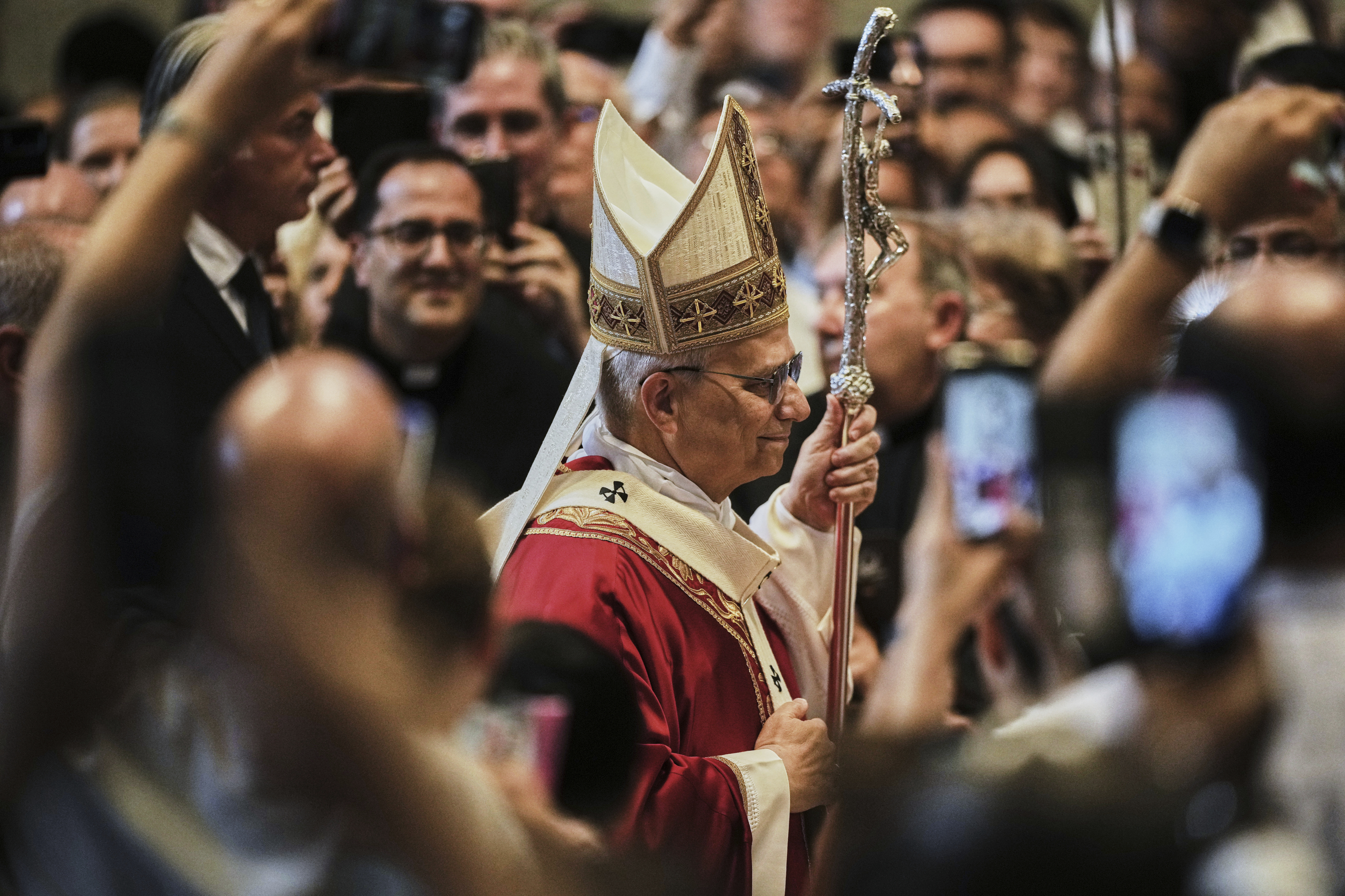 Pope Leo XIV arrives in St. Peter's Basilica at the Vatican to celebrate a Mass where he will bless the pallia for the new metropolitan archbishops, Sunday, June 29, 2025. (AP Photo/Andrew Medichini)