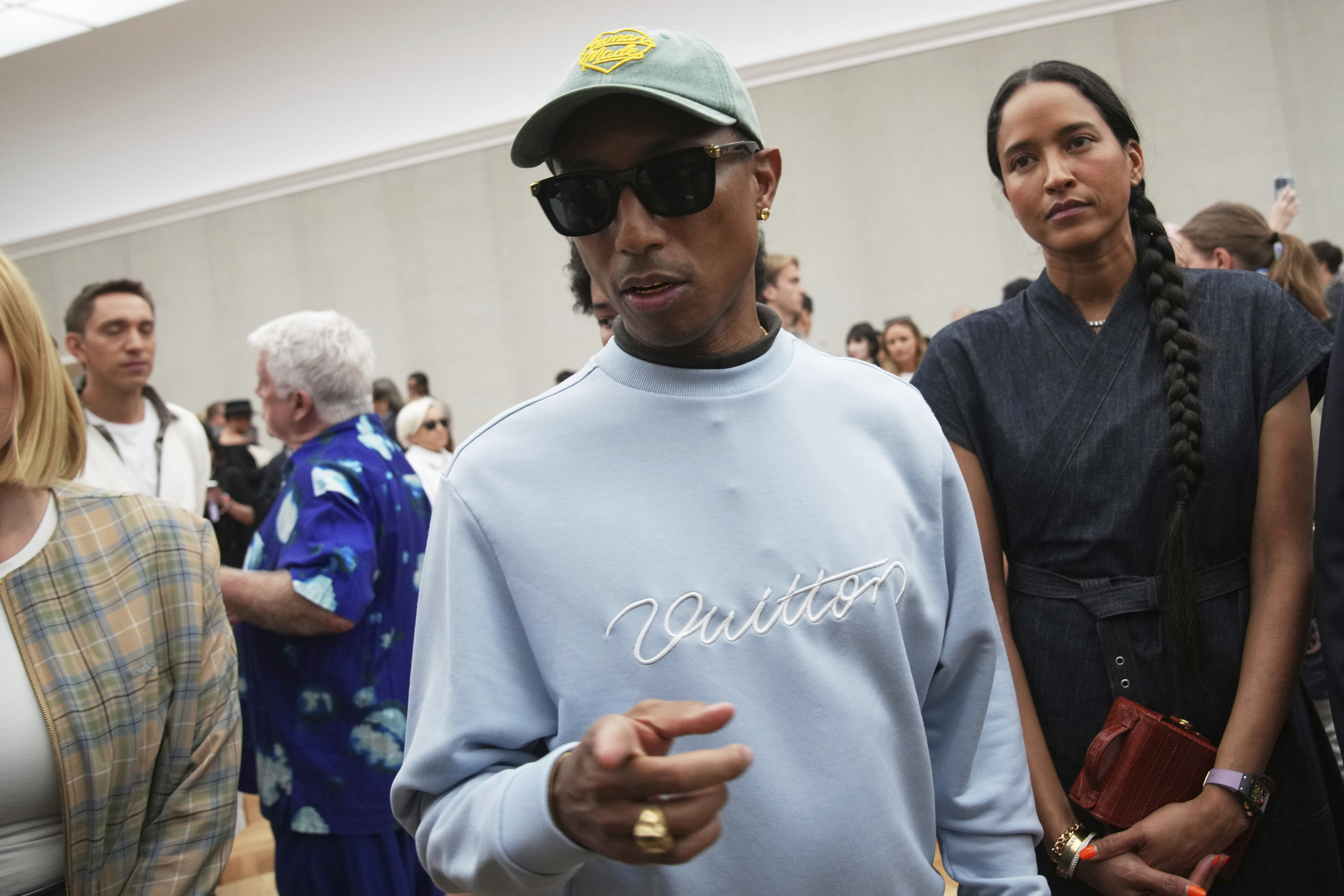 Pharrell Williams attends Dior Homme Spring-Summer 2026 collection, that was presented in Paris Friday, June 27, 2025. (AP Photo/Christophe Ena)