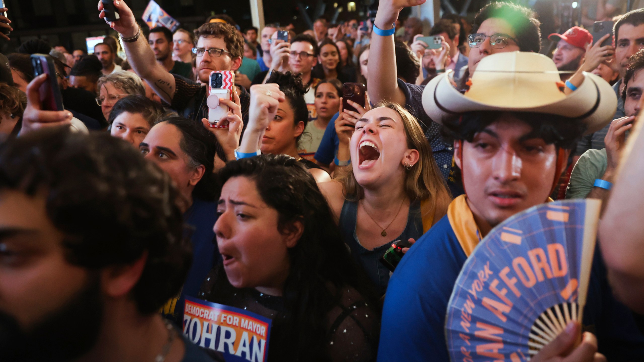 Supporters of Democratic mayoral candidate Zohran Mamdani cheer while he speaks at his primary election party, Wednesday, June 25, 2025, in New York. (AP Photo/Heather Khalifa)