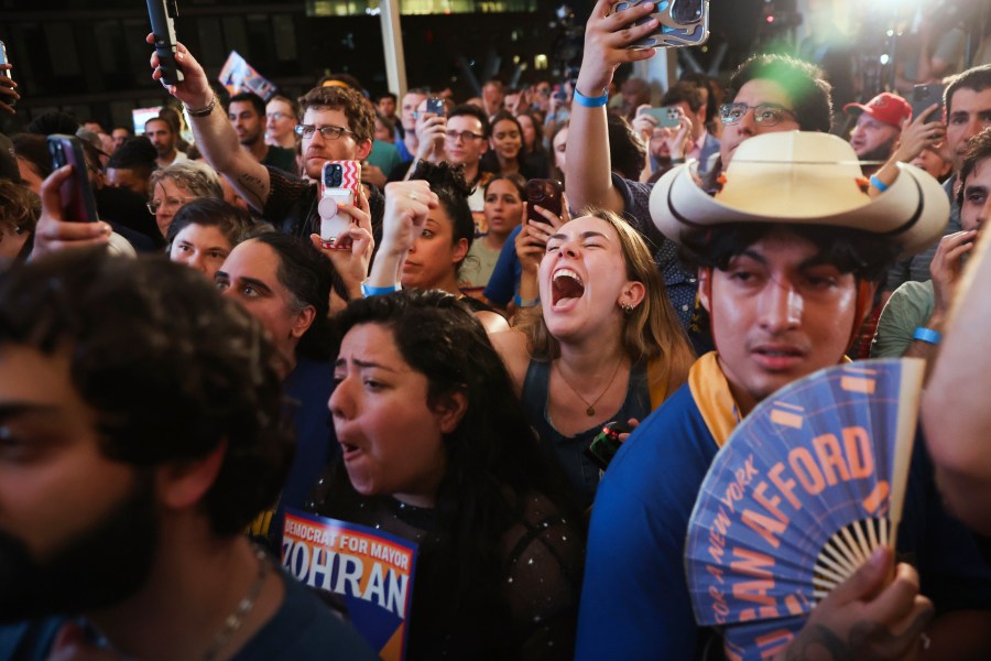 Supporters of Democratic mayoral candidate Zohran Mamdani cheer while he speaks at his primary election party, Wednesday, June 25, 2025, in New York. (AP Photo/Heather Khalifa)
