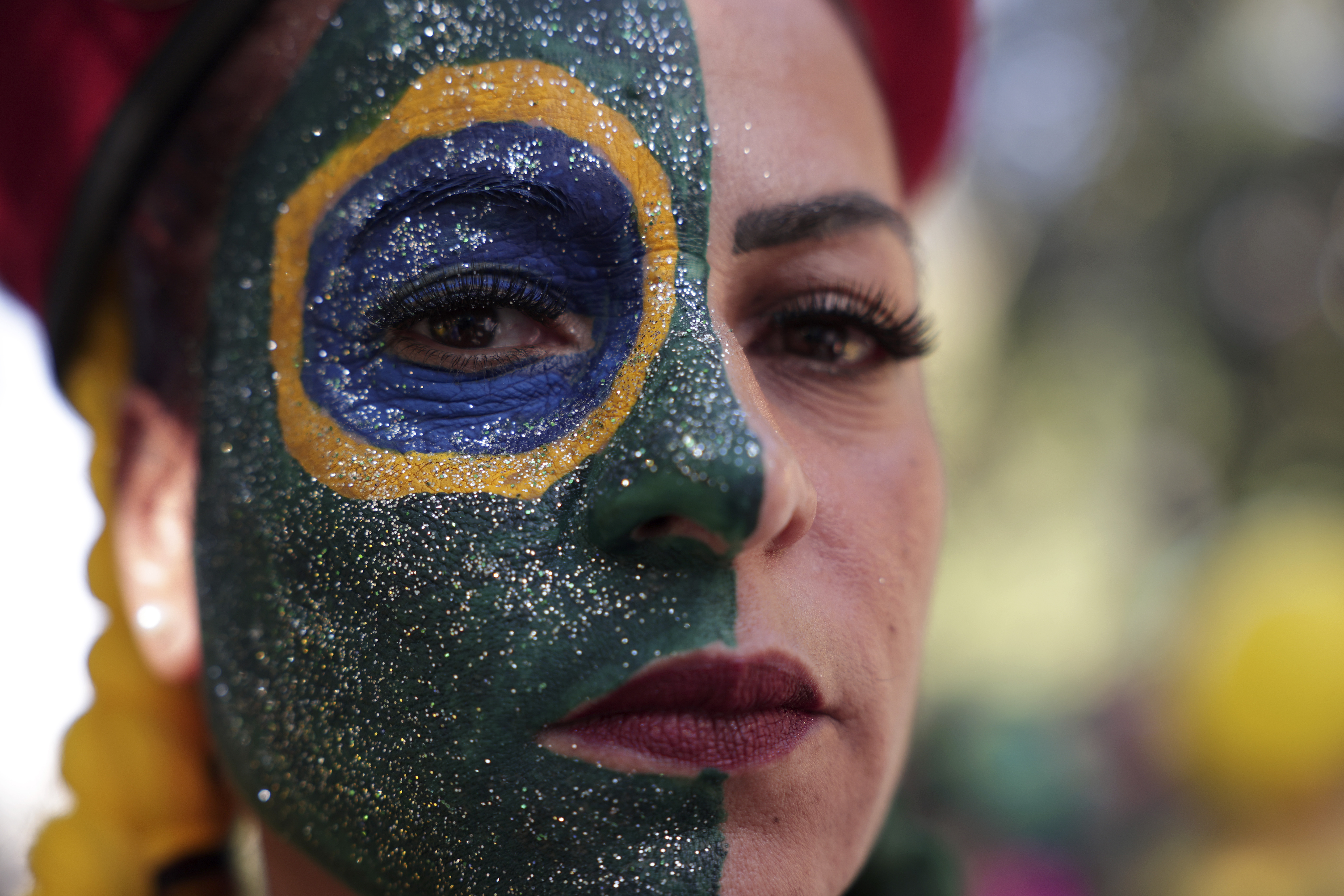 A supporter of former President Jair Bolsonaro attends a protest against his Supreme Court trial, in which he is accused of involvement in a 2022 coup attempt, in Sao Paulo, Sunday, June, 29, 2025. (AP Photo/Ettore Chiereguini)