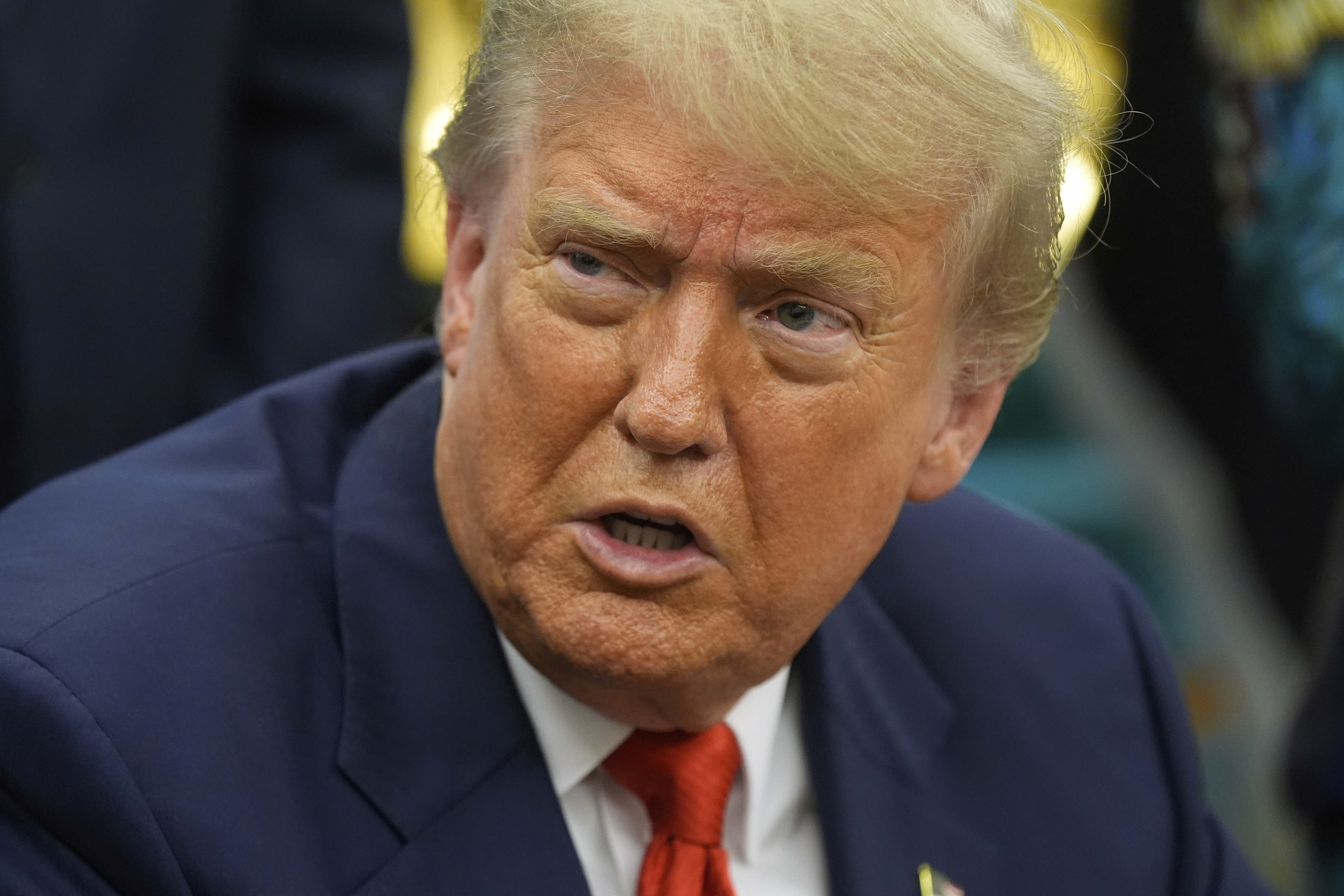 President Donald Trump answers questions from reporters as he meets with Congo's Foreign Minister Therese Kayikwamba Wagner, and Rwanda's Foreign Minister Olivier Nduhungirehe, Friday, June 27, 2025, in the Oval Office at the White House in Washington. (AP Photo/Manuel Balce Ceneta)
