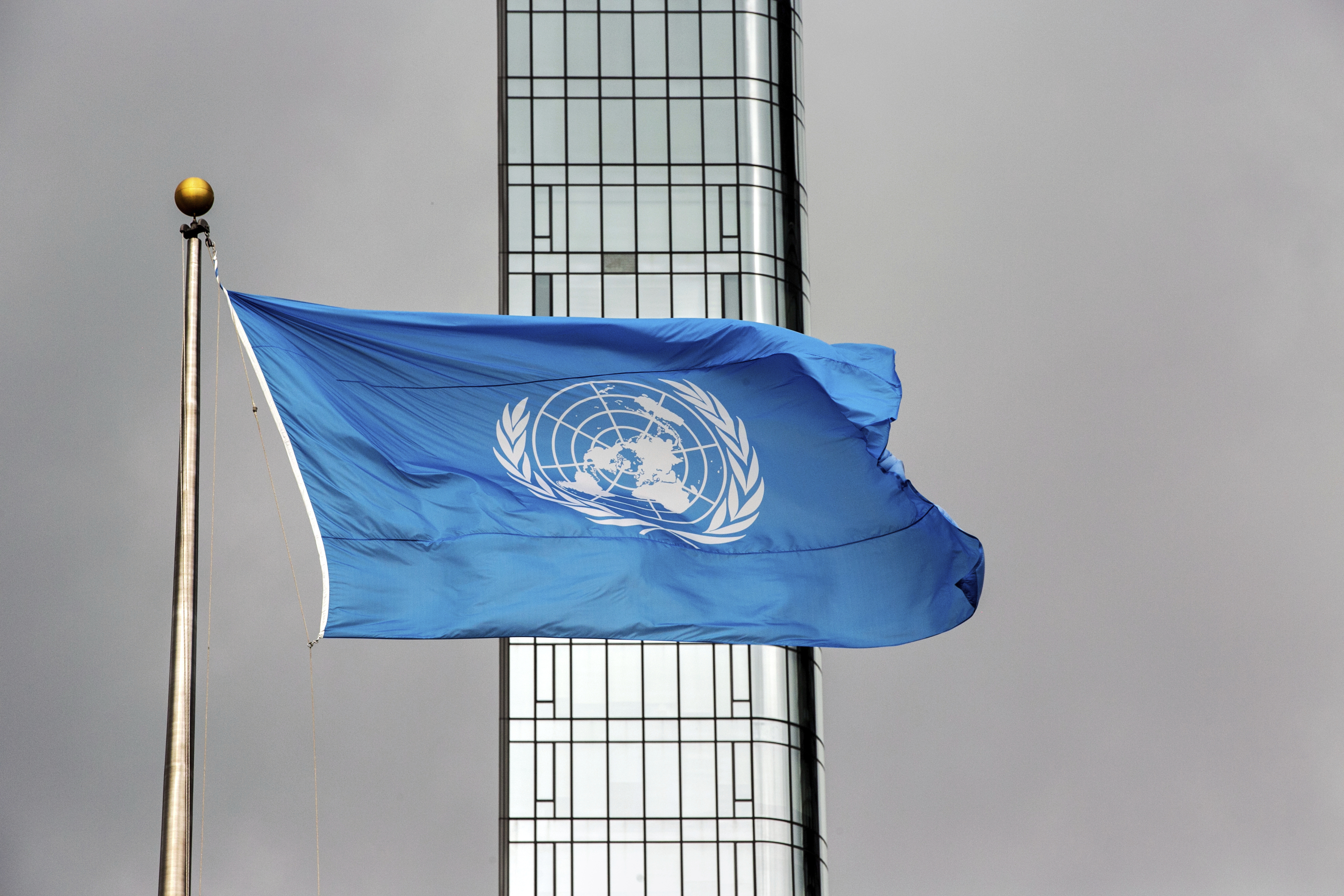 FILE - The United Nations flag flies on a stormy day at the U.N. during the United Nations General Assembly, Sept. 22, 2022. (AP Photo/Ted Shaffrey, File)