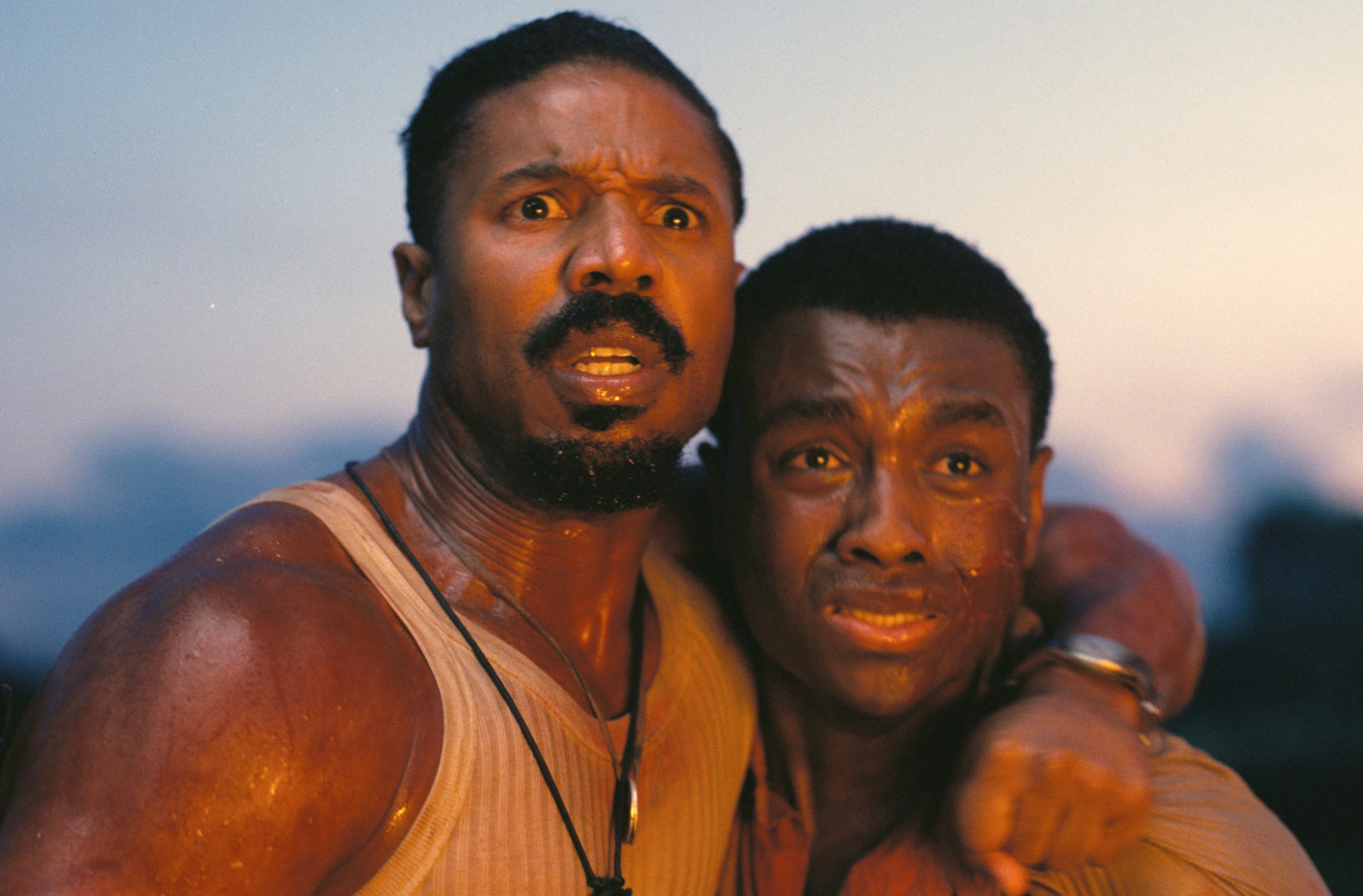 This image released by Warner Bros Pictures shows Michael B. Jordan, left, and Miles Caton in a scene from "Sinners." (Warner Bros. Pictures via AP)