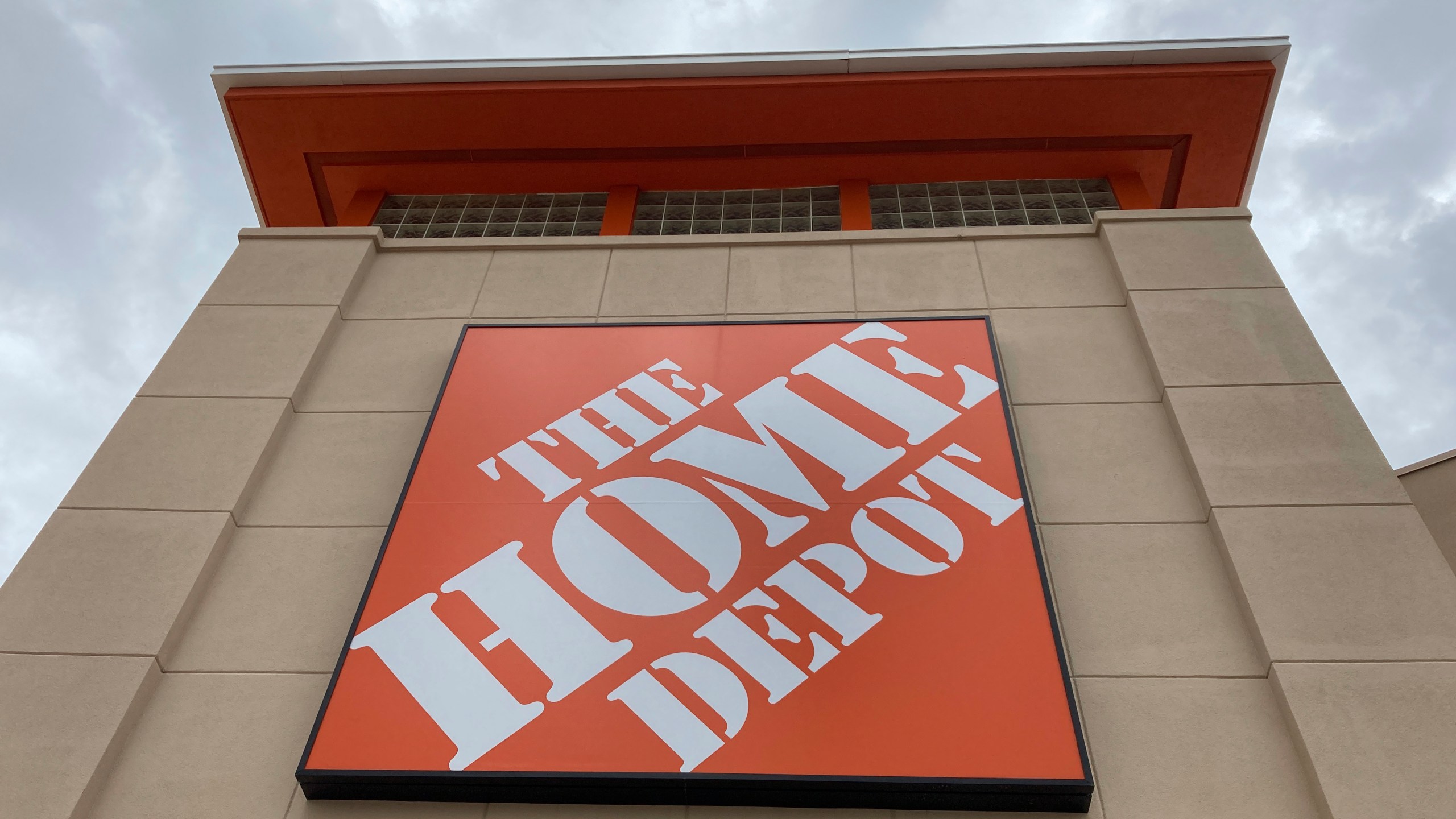 FILE - A Home Depot logo sign hands on its facade, Friday, May 14, 2021, in North Miami, Fla. (AP Photo/Wilfredo Lee, File)