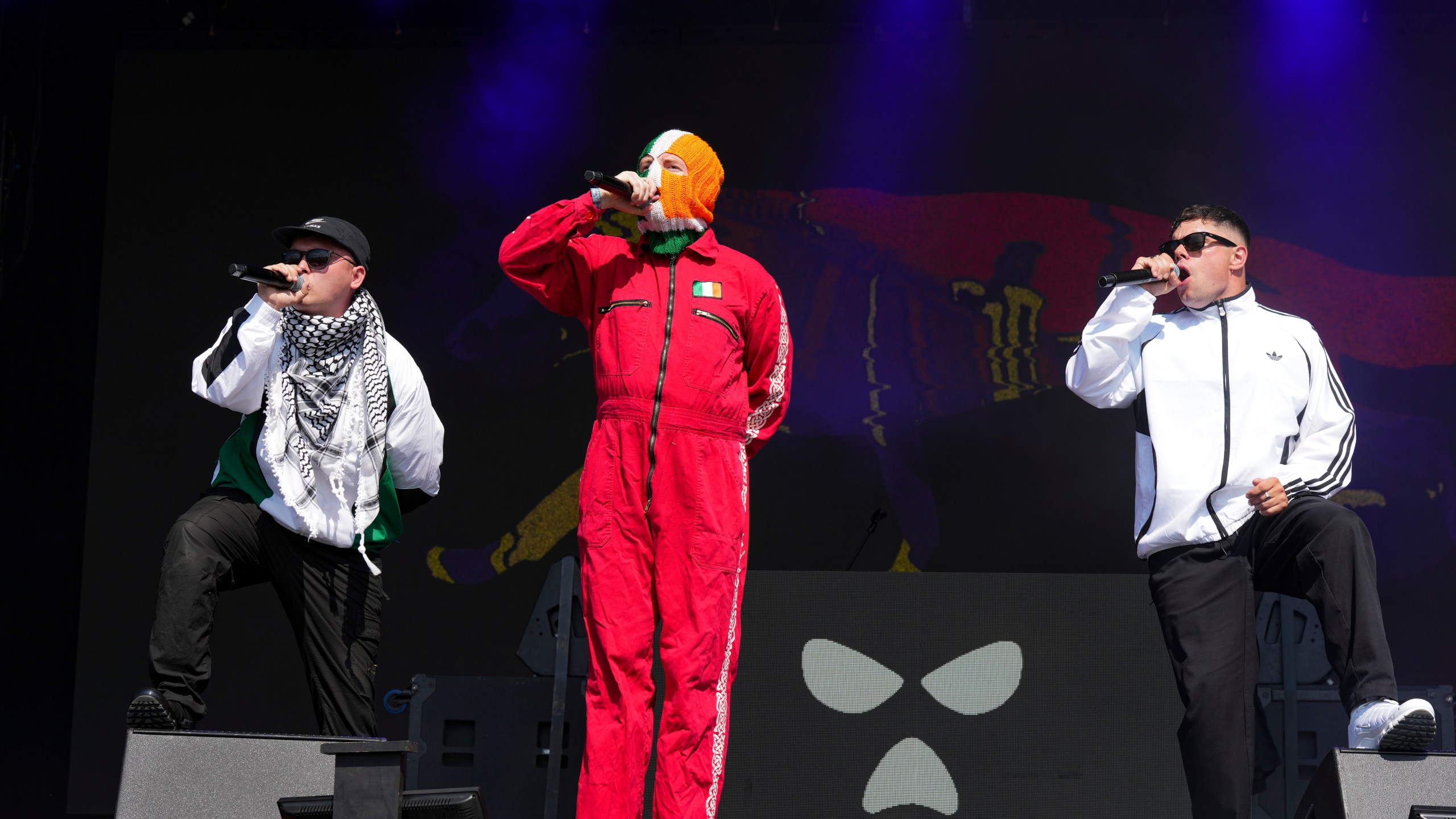 Hip hop trio Kneecap perform during the Glastonbury Festival in Worthy Farm, Somerset, England, Saturday, June 28, 2025. (Scott A Garfitt/Invision/AP)