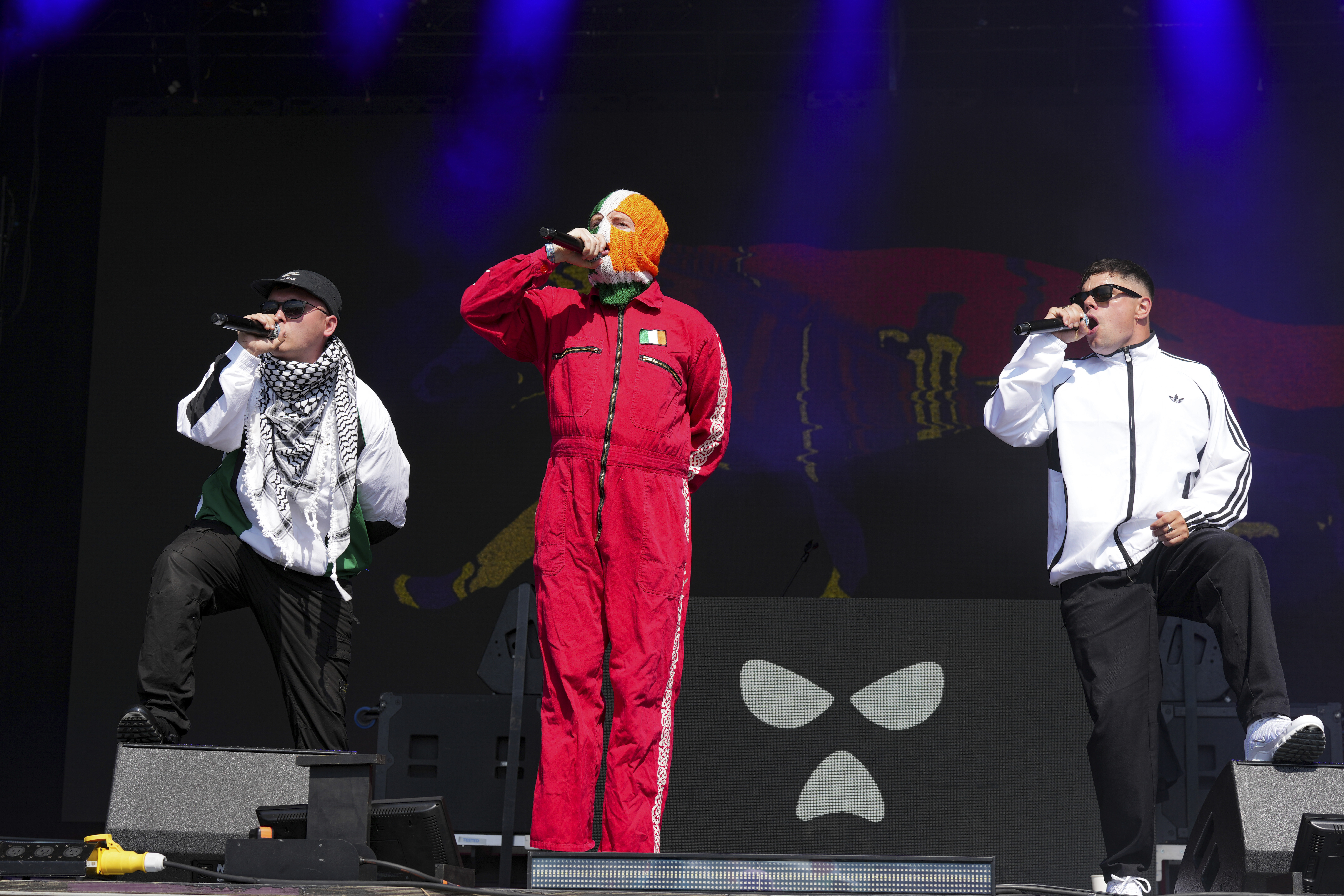 Hip hop trio Kneecap perform during the Glastonbury Festival in Worthy Farm, Somerset, England, Saturday, June 28, 2025. (Scott A Garfitt/Invision/AP)