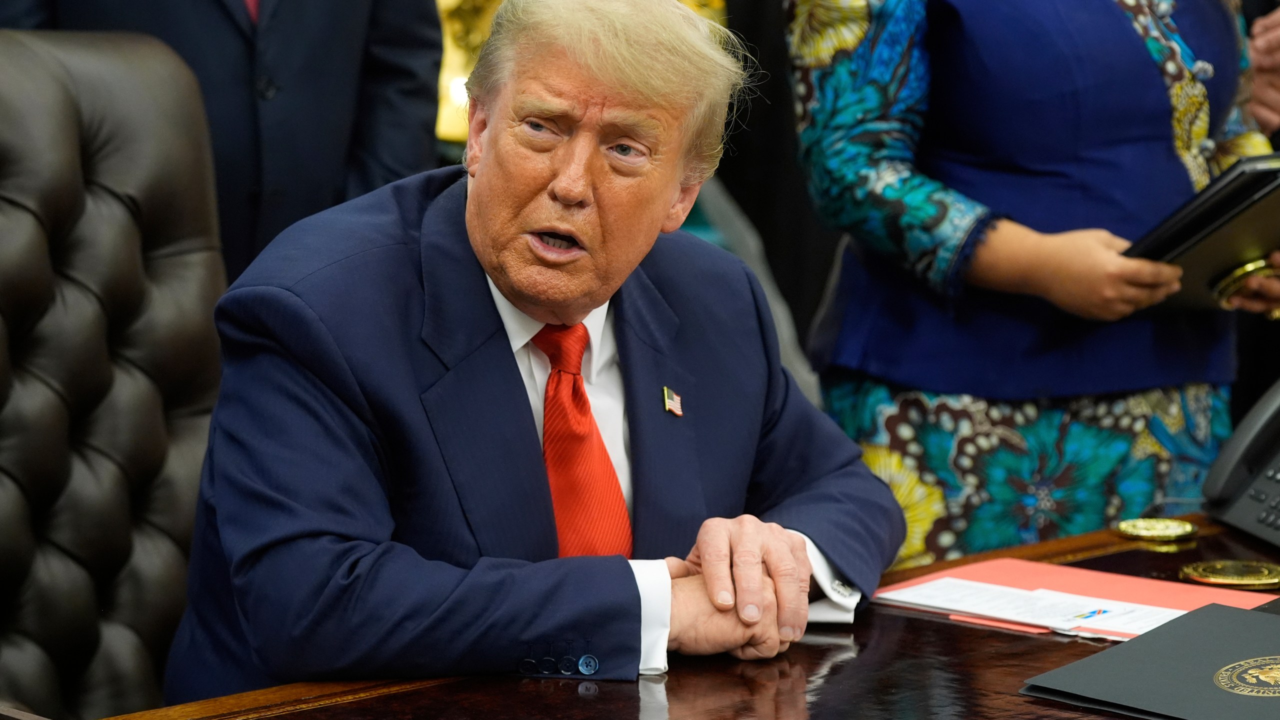 President Donald Trump answers questions from reporters as he meets with Congo's Foreign Minister Therese Kayikwamba Wagner, and Rwanda's Foreign Minister Olivier Nduhungirehe, Friday, June 27, 2025, in the Oval Office at the White House in Washington. (AP Photo/Manuel Balce Ceneta)