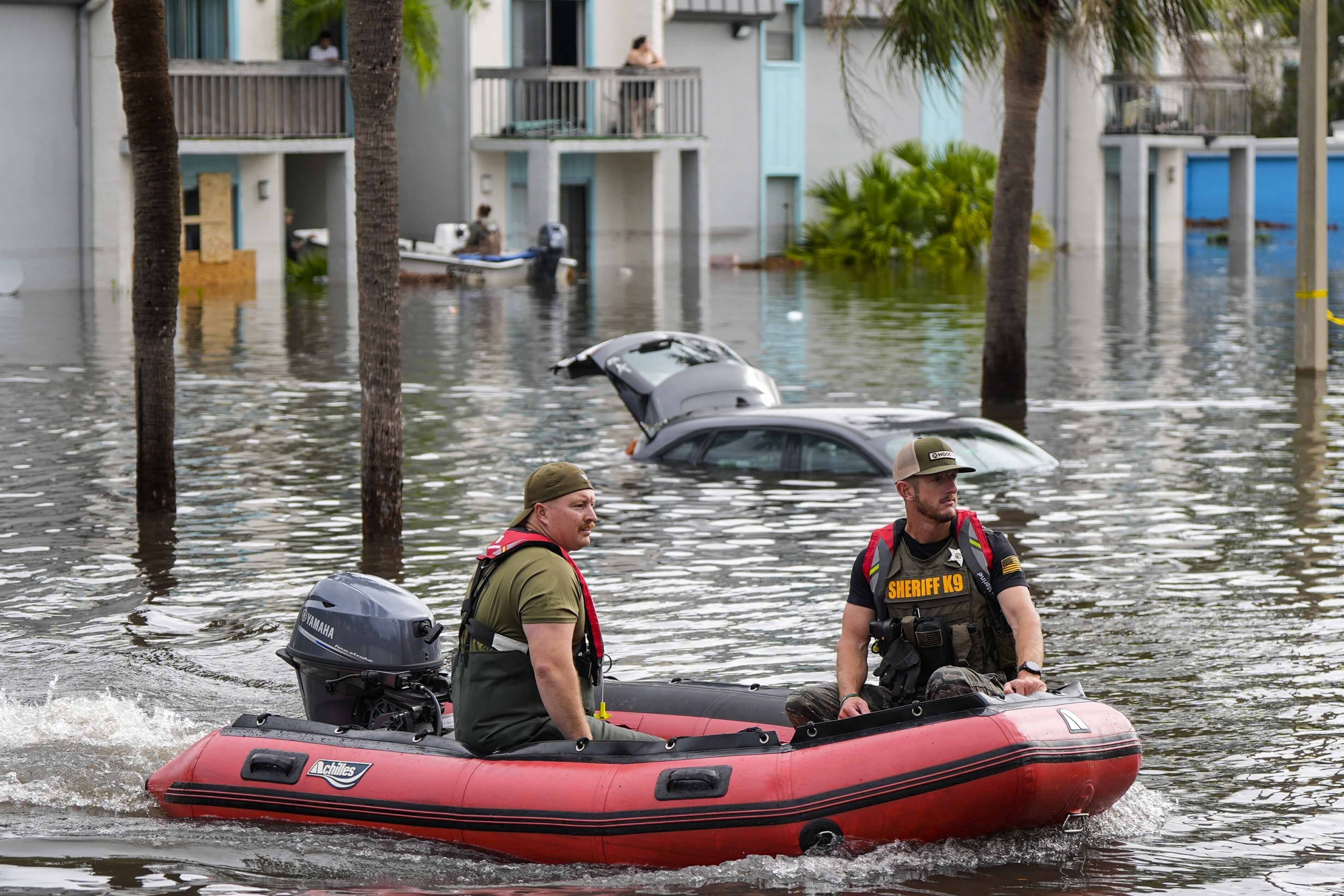 FILE - A water rescue boat moves in floodwaters at an apartment complex in the aftermath of Hurricane Milton, Oct. 10, 2024, in Clearwater, Fla. (AP Photo/Mike Stewart, File)