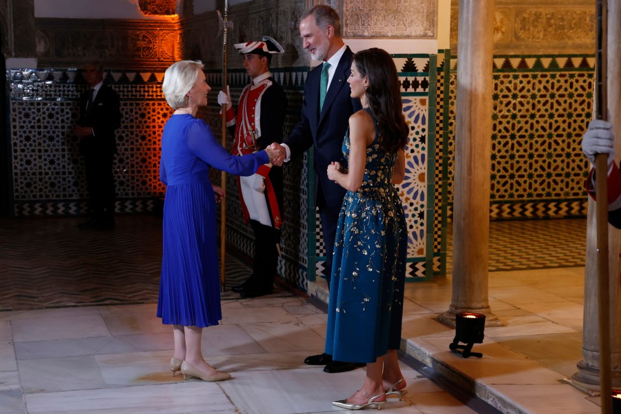 Spain's King Felipe VI and Queen Letizia greet European Commission President Ursula von der Leyen before a gala dinner on the eve of the U.N. financing for development conference in Seville, Spain, Sunday, June 29, 2025. (Mariscal/Pool Photo via AP)