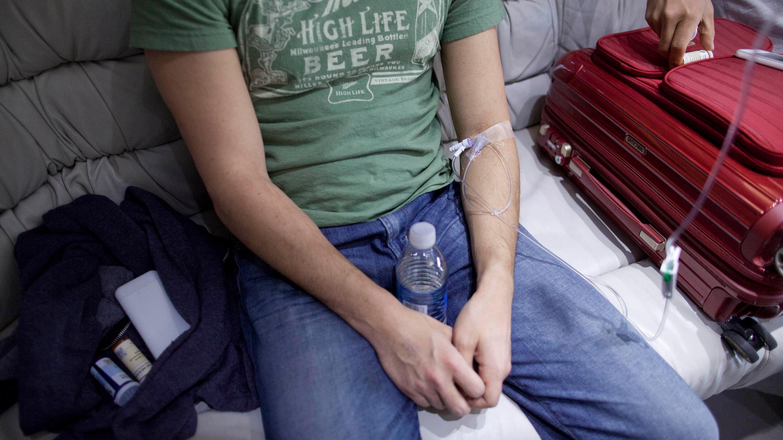 A patient is hooked up to an IV for a hangover treatment in Las Vegas on Sunday, April 15, 2012. (AP Photo/Julie Jacobson)