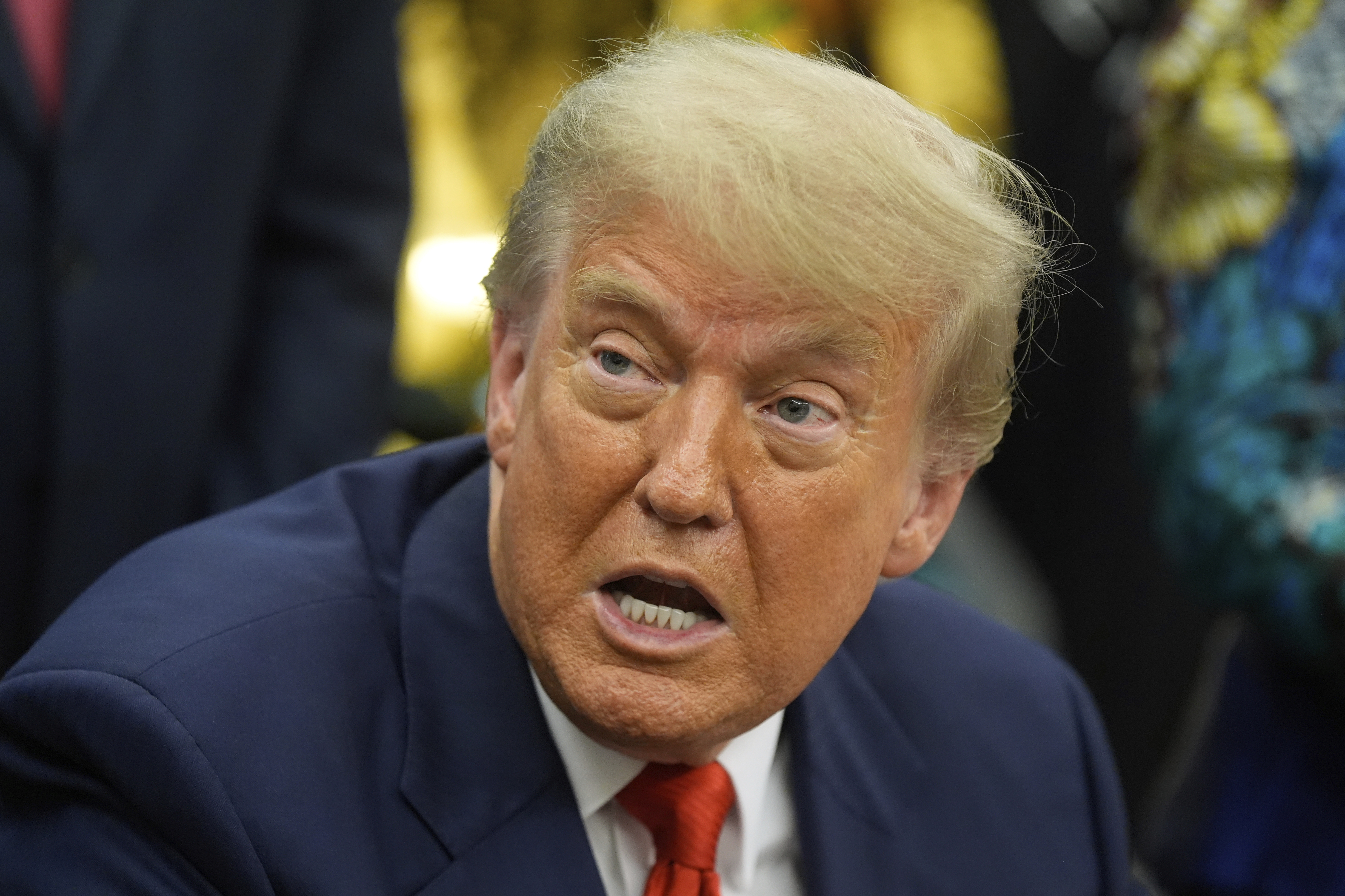 President Donald Trump answers questions from reporters as he meets with Congo's Foreign Minister Therese Kayikwamba Wagner, and Rwanda's Foreign Minister Olivier Nduhungirehe, Friday, June 27, 2025, in the Oval Office at the White House in Washington. (AP Photo/Manuel Balce Ceneta)