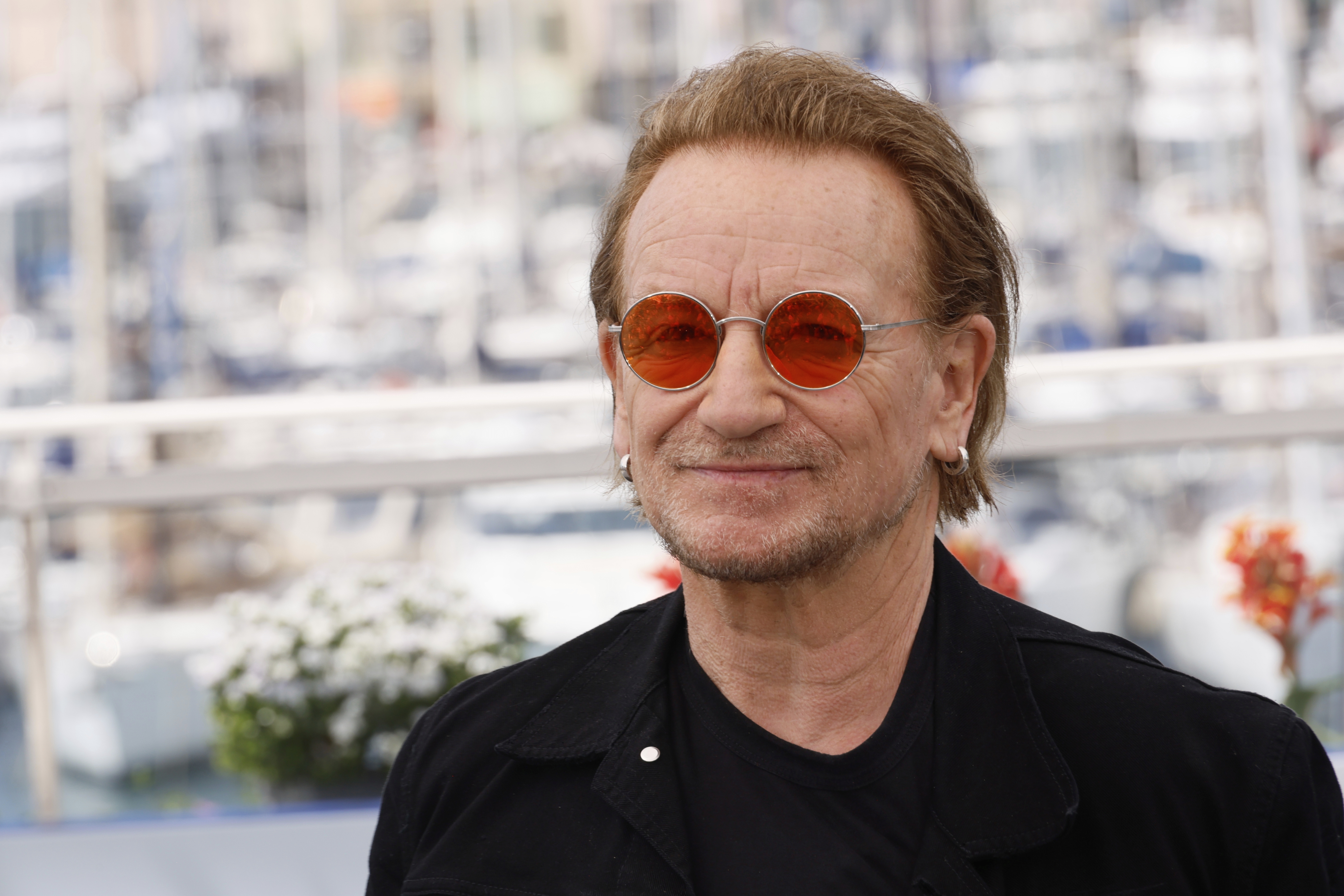FILE - Bono poses for photographers at the 78th international film festival, Cannes, southern France, May 17, 2025. (Photo by Joel C Ryan/Invision/AP, File)