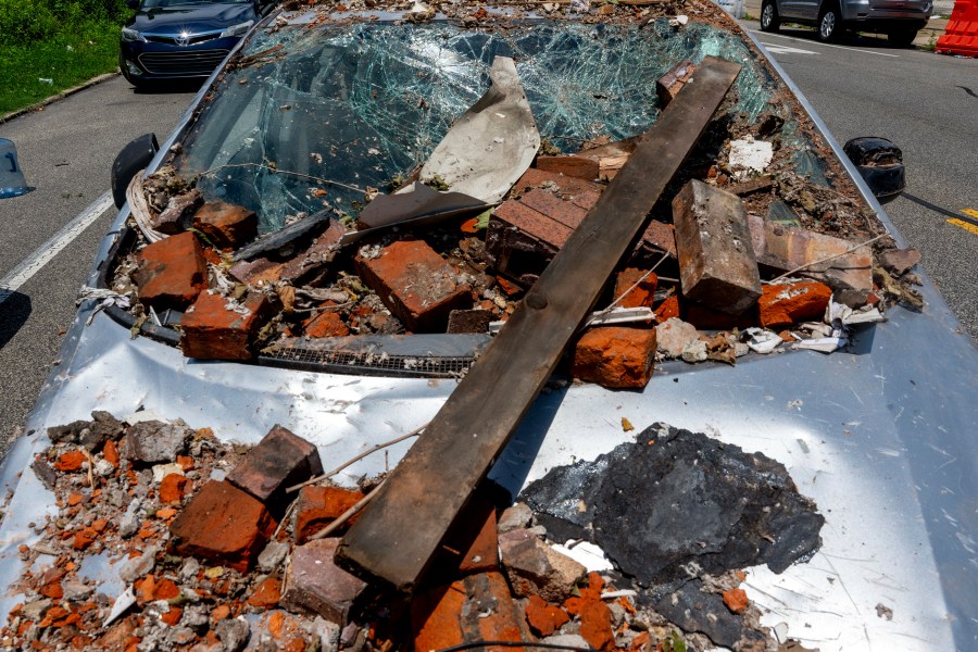 Debris covers a vehicle in the Nicetown area of Philadelphia, Sunday, June 29, 2025, after an explosion damaged several homes. (Tom Gralish/The Philadelphia Inquirer via AP)