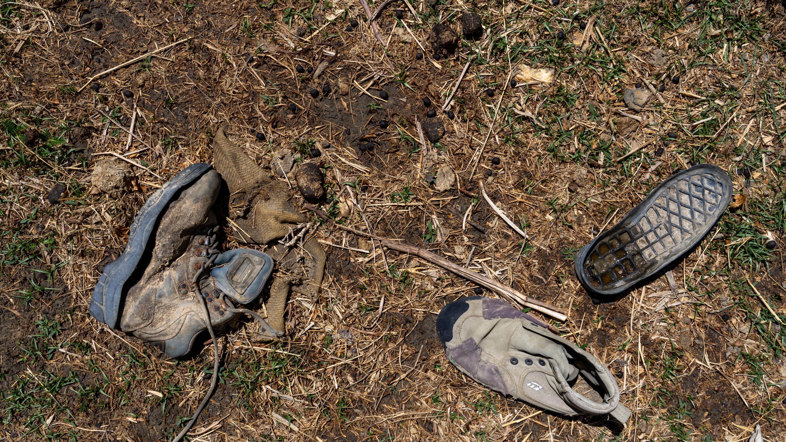 Worn out shoes are strewn in a field in the abandoned Samjung village, Mustang region, 462 kilometers (288 miles) west of Kathmandu, Nepal, Friday, April 18, 2025. (AP Photo/Niranjan Shrestha)