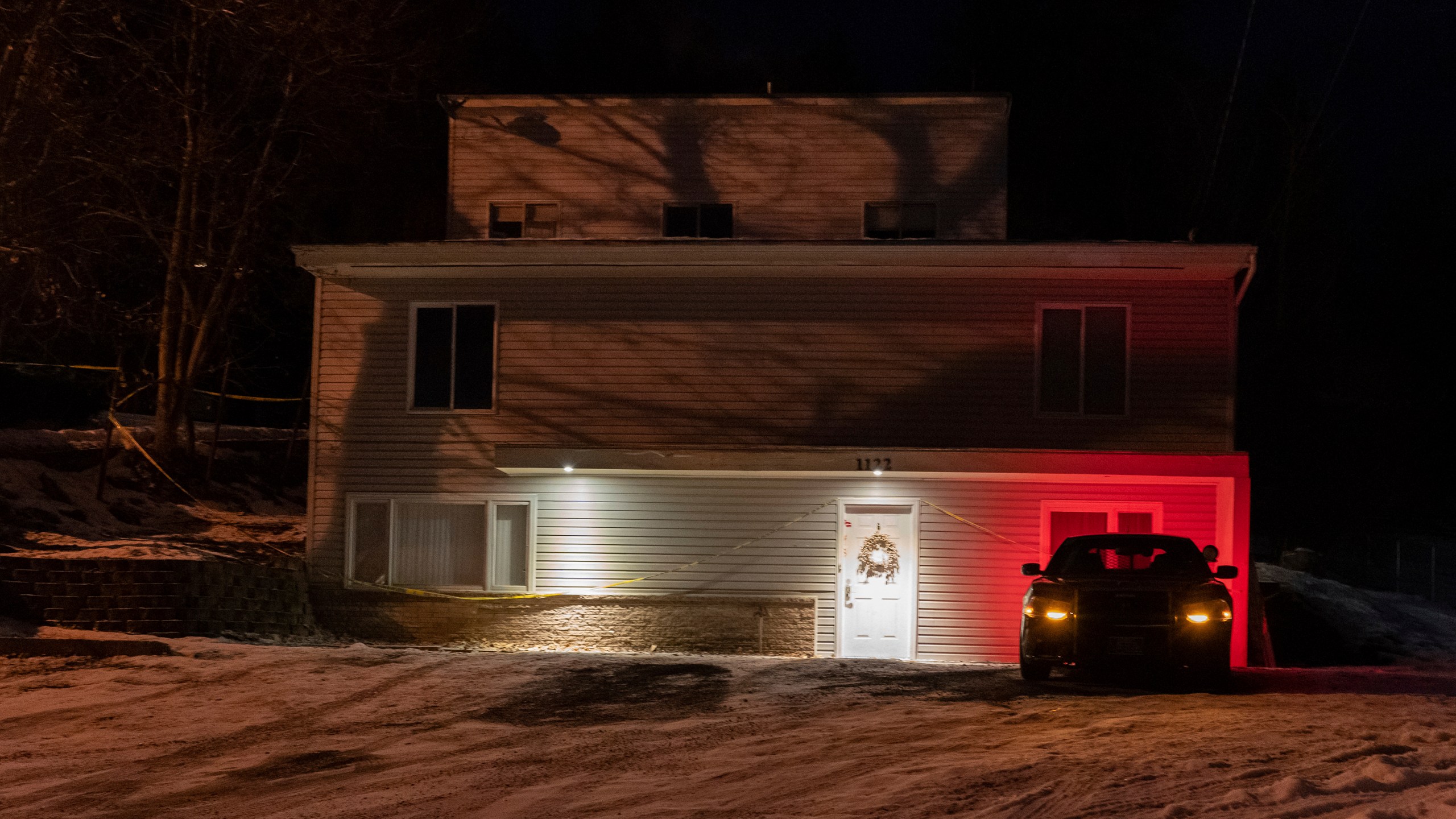 FILE - A private security officer sits in a vehicle on Jan. 3, 2023, in front of the house in Moscow, Idaho, where four University of Idaho students were killed in November 2022. (AP Photo/Ted S. Warren, File)