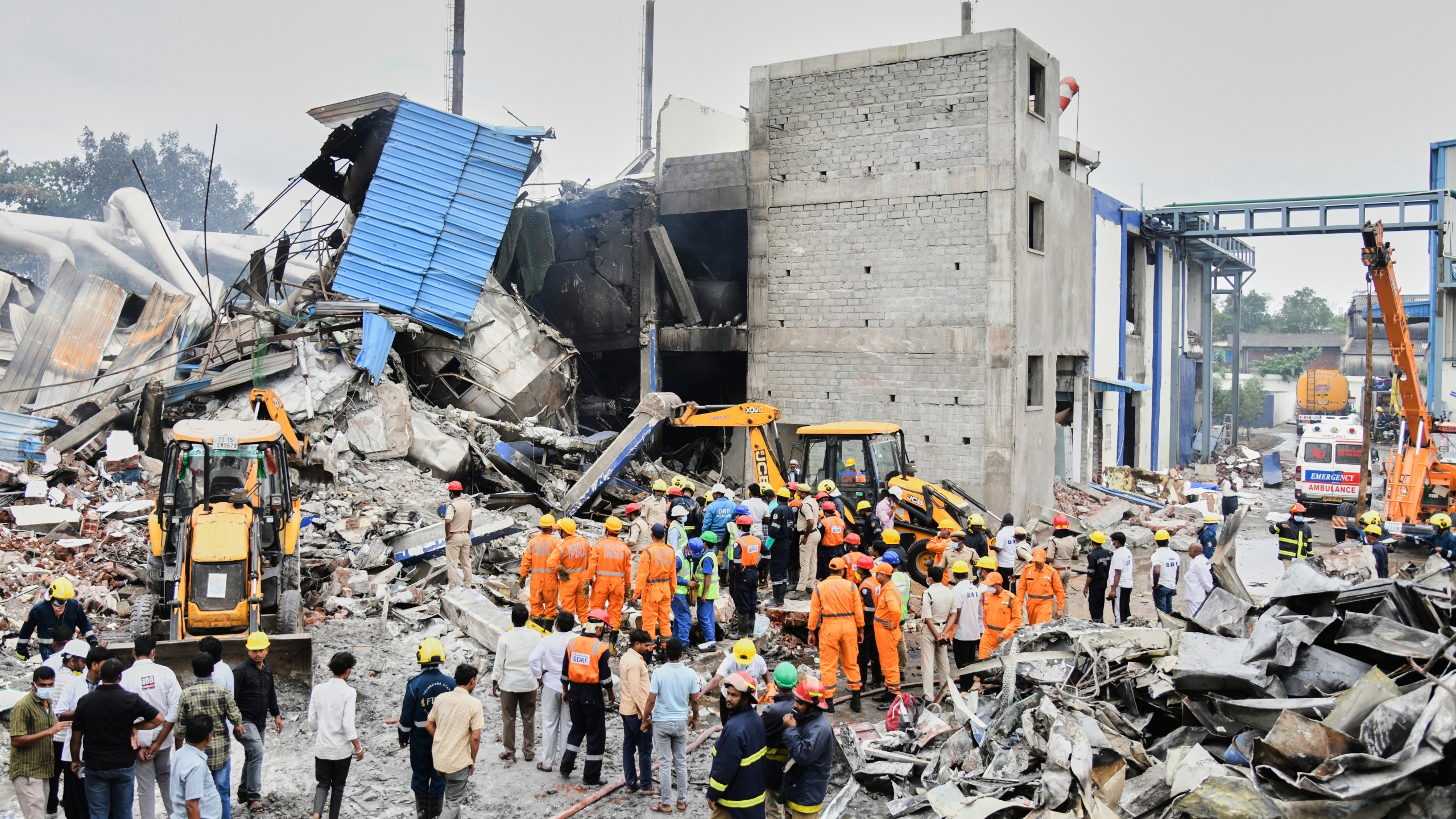 Rescue workers look for survivors after at an explosion and a fire at a pharmaceutical factory in an industrial area in Sangareddy, some 50 kilometers (31 miles) from Hyderabad, India, Monday, June 30, 2025. (AP Photo)