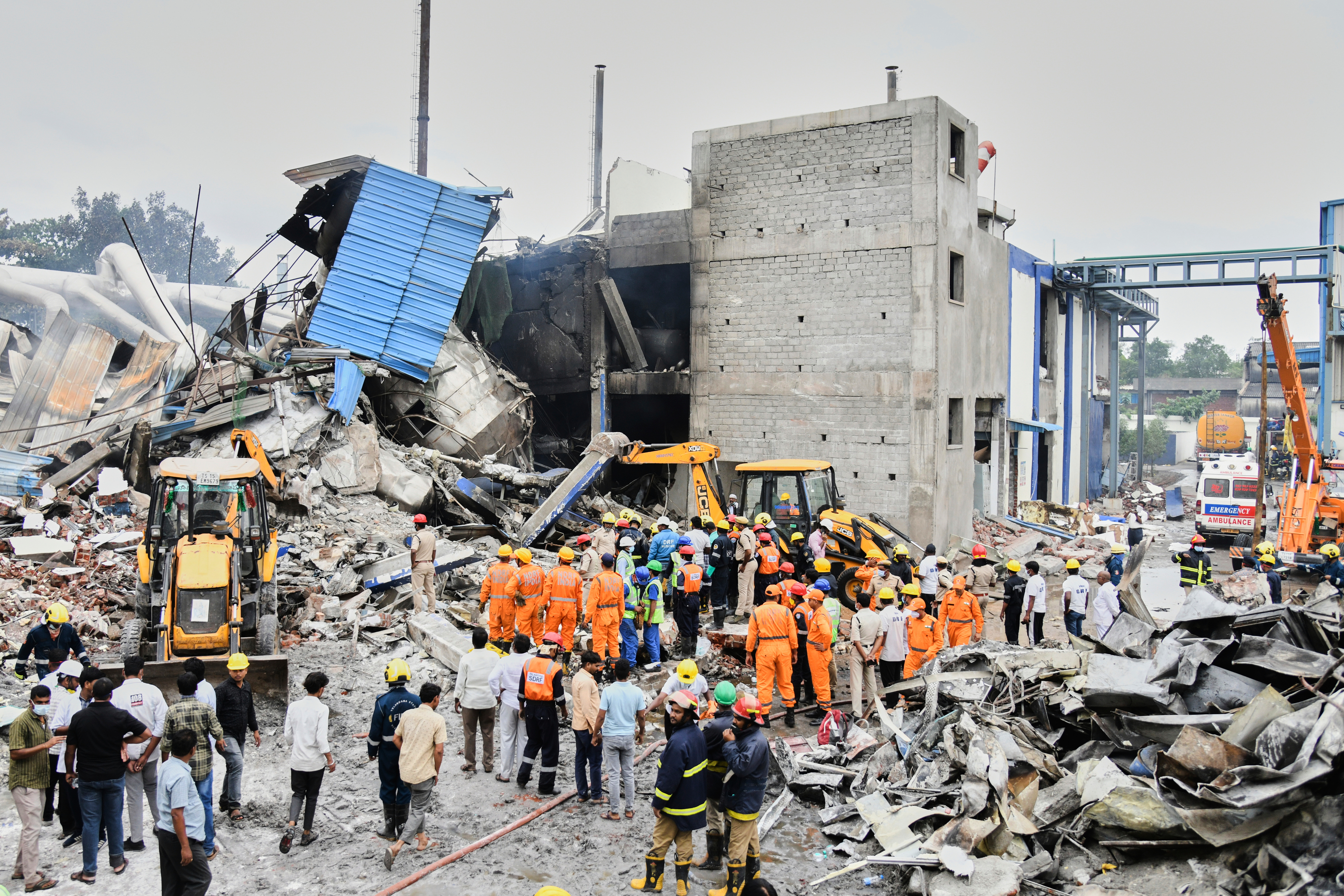 Rescue workers look for survivors after at an explosion and a fire at a pharmaceutical factory in an industrial area in Sangareddy, some 50 kilometers (31 miles) from Hyderabad, India, Monday, June 30, 2025. (AP Photo)