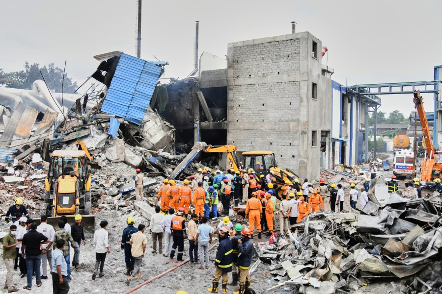 Rescue workers look for survivors after at an explosion and a fire at a pharmaceutical factory in an industrial area in Sangareddy, some 50 kilometers (31 miles) from Hyderabad, India, Monday, June 30, 2025. (AP Photo)